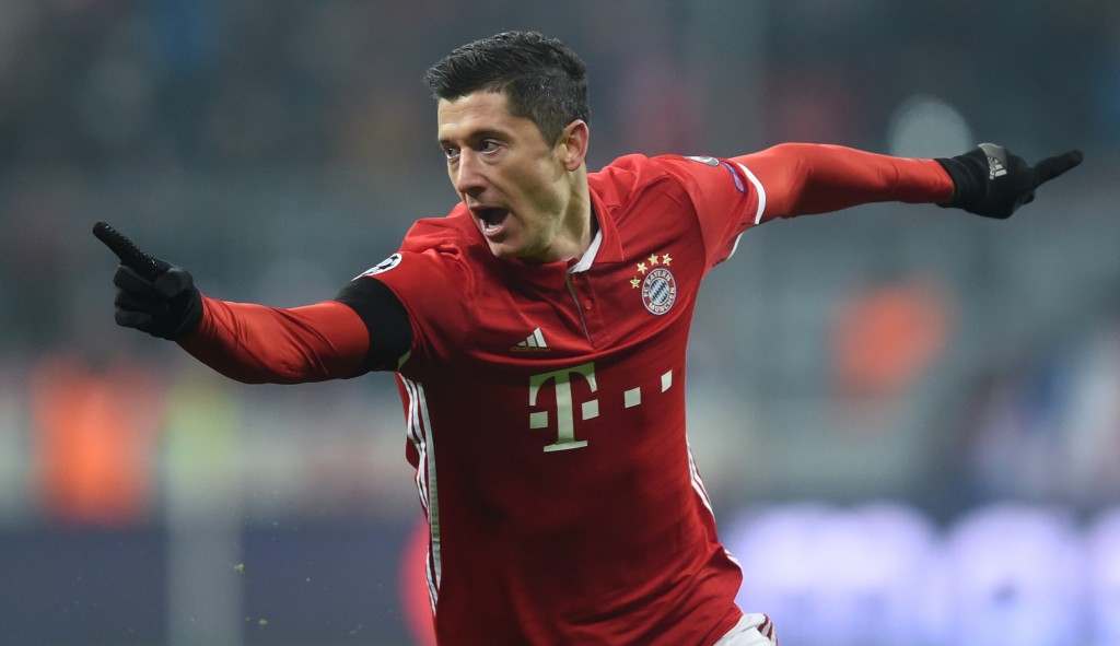Bayern Munich's Polish striker Robert Lewandowski celebrates scoring the opening goal during the UEFA Champions League group D football match between FC Bayern Munich and Atletico Madrid in Munich, southern Germany, on December 6, 2016. / AFP / CHRISTOF STACHE (Photo credit should read CHRISTOF STACHE/AFP/Getty Images)