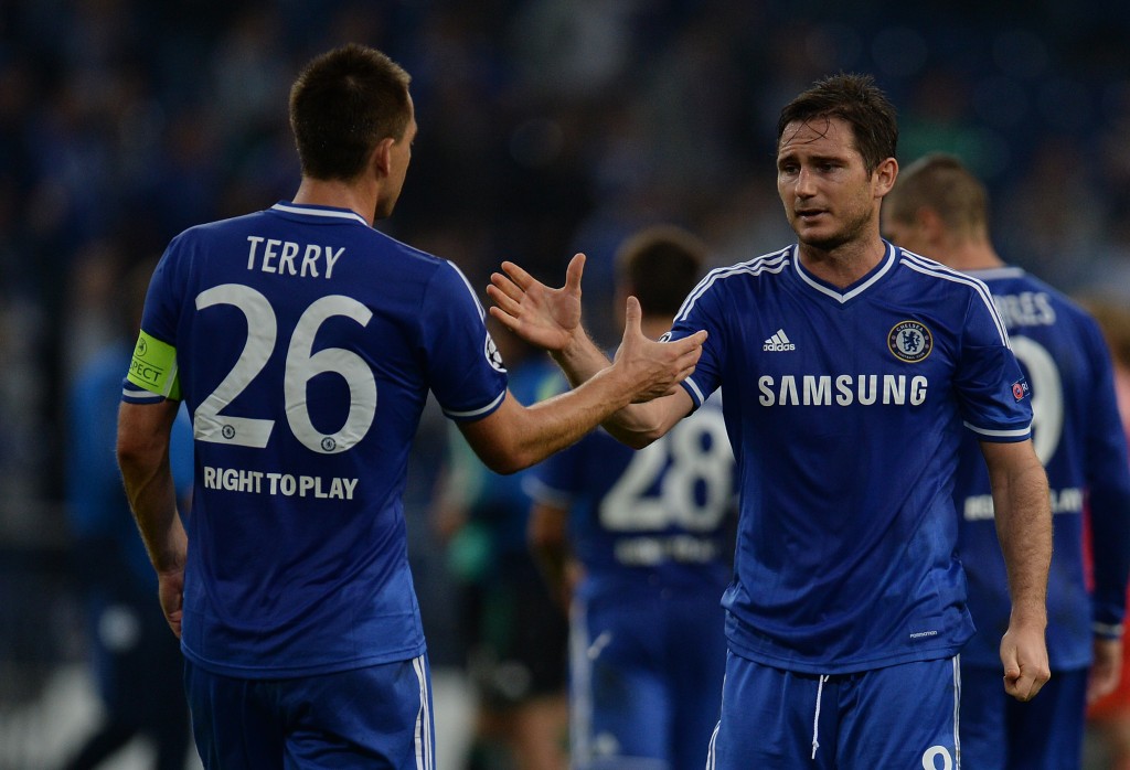 Chelsea?s defender John Terry (L) and Frank Lampard celebrate after the UEFA Champions League Group E football match Schalke 04 vs FC Chelsea in Gelsenkirchen, western Germany on October 22, 2013. AFP PHOTO / PATRIK STOLLARZ (Photo credit should read PATRIK STOLLARZ/AFP/Getty Images)