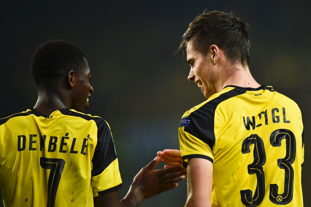 Dortmund's midfielder Julian Weigl (R) celebrates with his teammate Dortmund's French forward Ousmane Dembele (L) after scoring during the UEFA Champions League football match Sporting CP vs BVB Borussia Dortmund at the Jose Alvalade stadium in Lisbon on October 18, 2016. / AFP / PATRICIA DE MELO MOREIRA (Photo credit should read PATRICIA DE MELO MOREIRA/AFP/Getty Images)