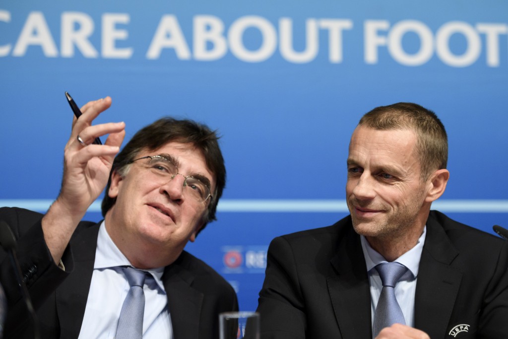 UEFA general secretary Theodore Theodoridis (L) gestures next to UEFA President Aleksander Ceferin during a press conference closing an executive meeting at the headquarters of the European football's governing body on December 9, 2016 in Nyon. / AFP / FABRICE COFFRINI (Photo credit should read FABRICE COFFRINI/AFP/Getty Images)