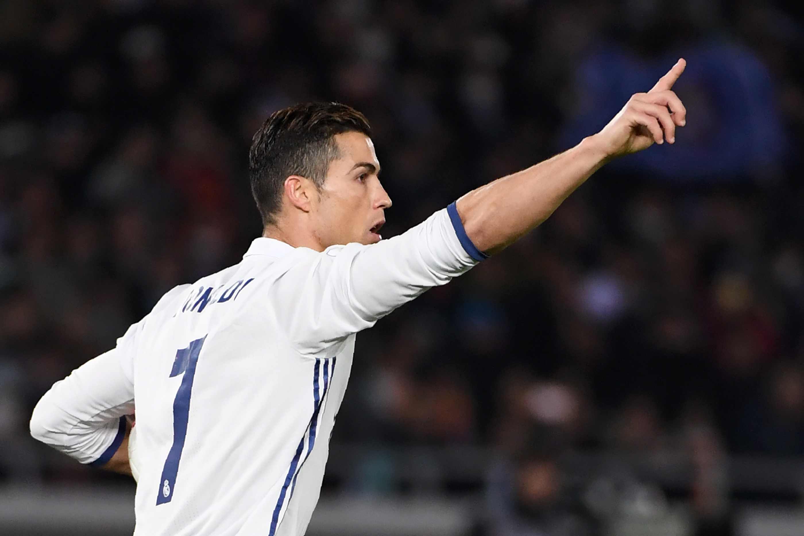 Real Madrid forward Cristiano Ronaldo celebrates scoring a penalty during the Club World Cup football final match between Kashima Antlers of Japan and Real Madrid of Spain at Yokohama International stadium in Yokohama on December 18, 2016. / AFP / Toshifumi KITAMURA        (Photo credit should read TOSHIFUMI KITAMURA/AFP/Getty Images)