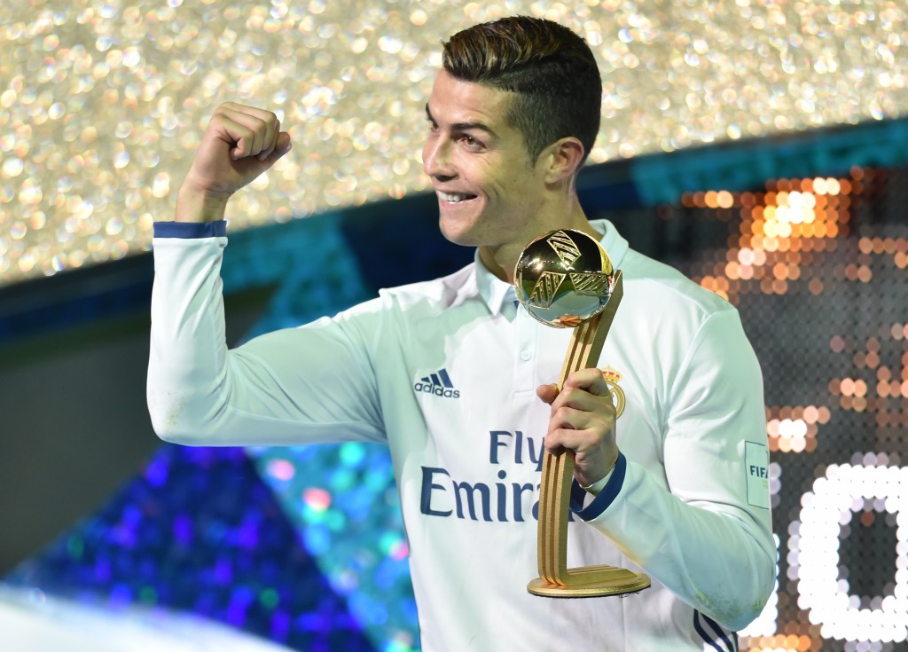 Real Madrid forward Cristiano Ronaldo receives the Golden Ball trophy after winning the Club World Cup football final match between Kashima Antlers of Japan and Real Madrid of Spain at Yokohama International stadium in Yokohama on December 18, 2016. (Photo by Kazuhiro Nogi/AFP/Getty Images)