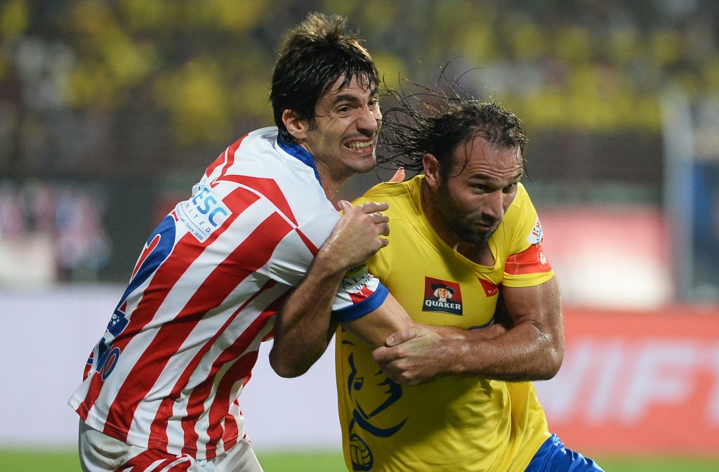 Kerala Blasters FC defender Cedric Hengbart (R) vies for the ball with Atletico de Kolkata defender Henrique Fonseca Sereno (L) during the final Indian Super League (ISL) football match between Kerala Blasters FC and Atletico de Kolkata at the Jawahar Lal Nehru Stadium in Kochi on December 18, 2016.   ----IMAGE RESTRICTED TO EDITORIAL USE - STRICTLY NO COMMERCIAL USE----- / AFP / SAJJAD HUSSAIN        (Photo credit should read SAJJAD HUSSAIN/AFP/Getty Images)