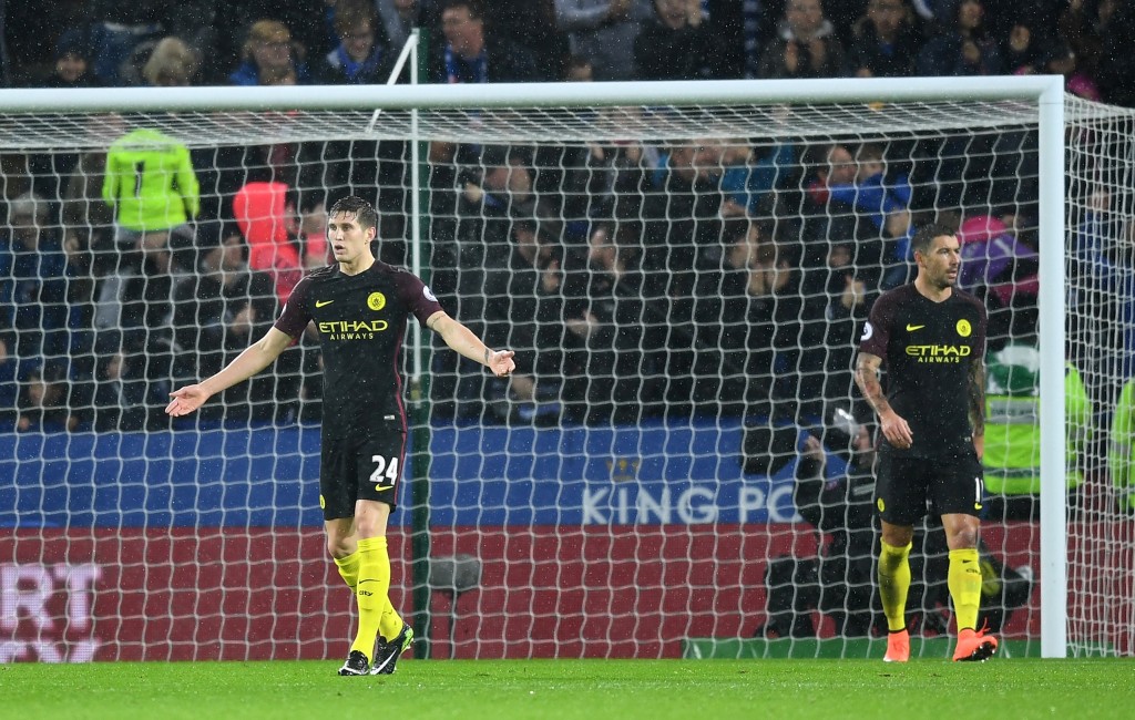 LEICESTER, ENGLAND - DECEMBER 10: John Stones of Manchester City is dejected after Jamie Vardy of Leicester City scores a third goal during the Premier League match between Leicester City and Manchester City at the King Power Stadium on December 10, 2016 in Leicester, England. (Photo by Michael Regan/Getty Images)
