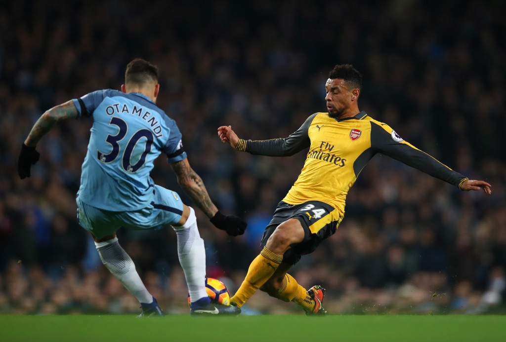 MANCHESTER, ENGLAND - DECEMBER 18: Nicolas Otamendi of Manchester City (L) and Francis Coquelin of Arsneal (R) battle for possession during the Premier League match between Manchester City and Arsenal at the Etihad Stadium on December 18, 2016 in Manchester, England. (Photo by Clive Brunskill/Getty Images)