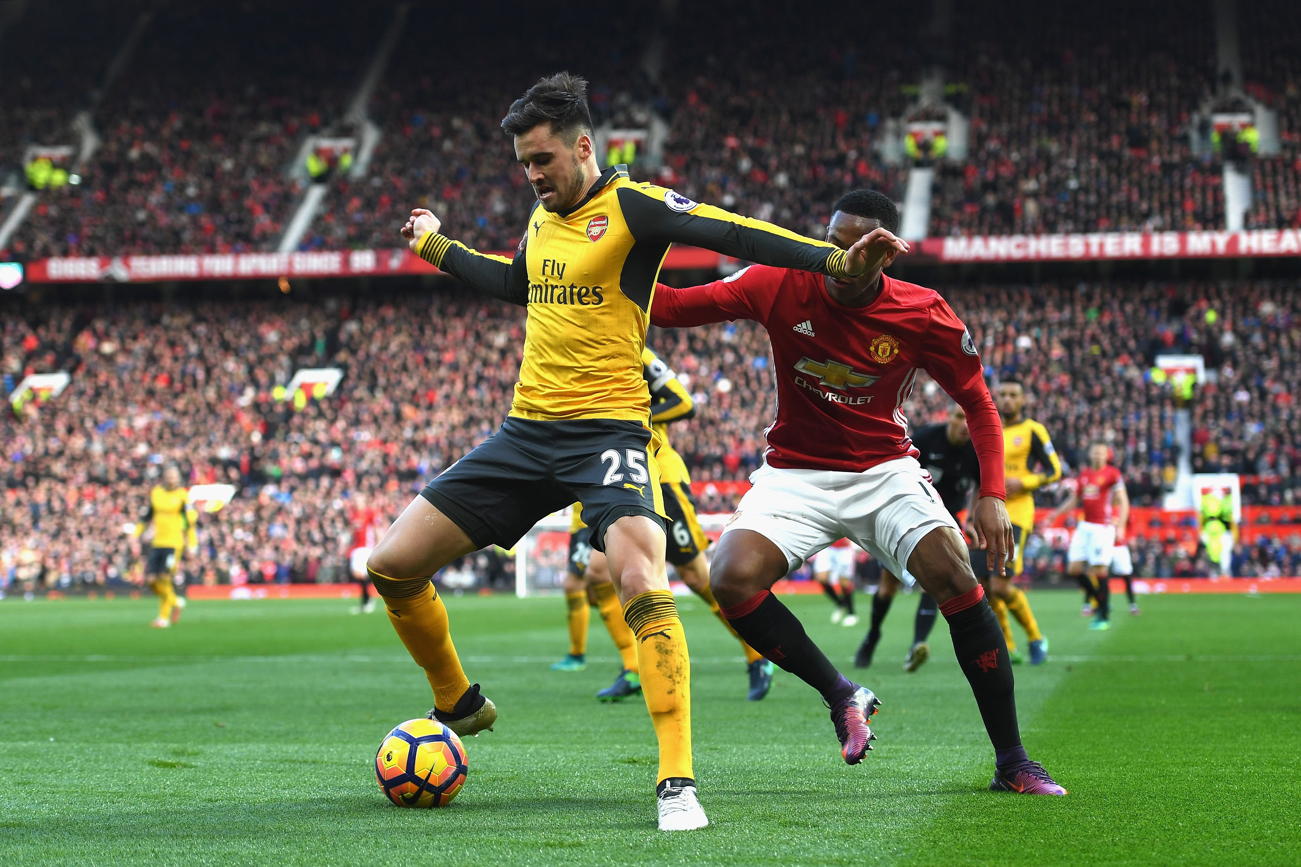 MANCHESTER, ENGLAND - NOVEMBER 19: Carl Jenkinson of Arsenal (L) is put under pressure from Anthony Martial of Manchester United (R) during the Premier League match between Manchester United and Arsenal at Old Trafford on November 19, 2016 in Manchester, England. (Photo by Shaun Botterill/Getty Images)