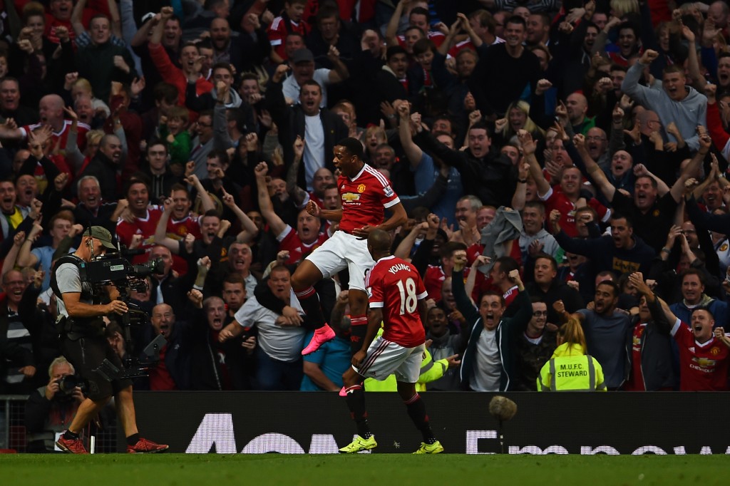 MANCHESTER, ENGLAND - SEPTEMBER 12: Anthony Martial of Manchester United celebrates scoring his team's third goal with Ashley Young during the Barclays Premier League match between Manchester United and Liverpool at Old Trafford on September 12, 2015 in Manchester, United Kingdom. (Photo by Laurence Griffiths/Getty Images)