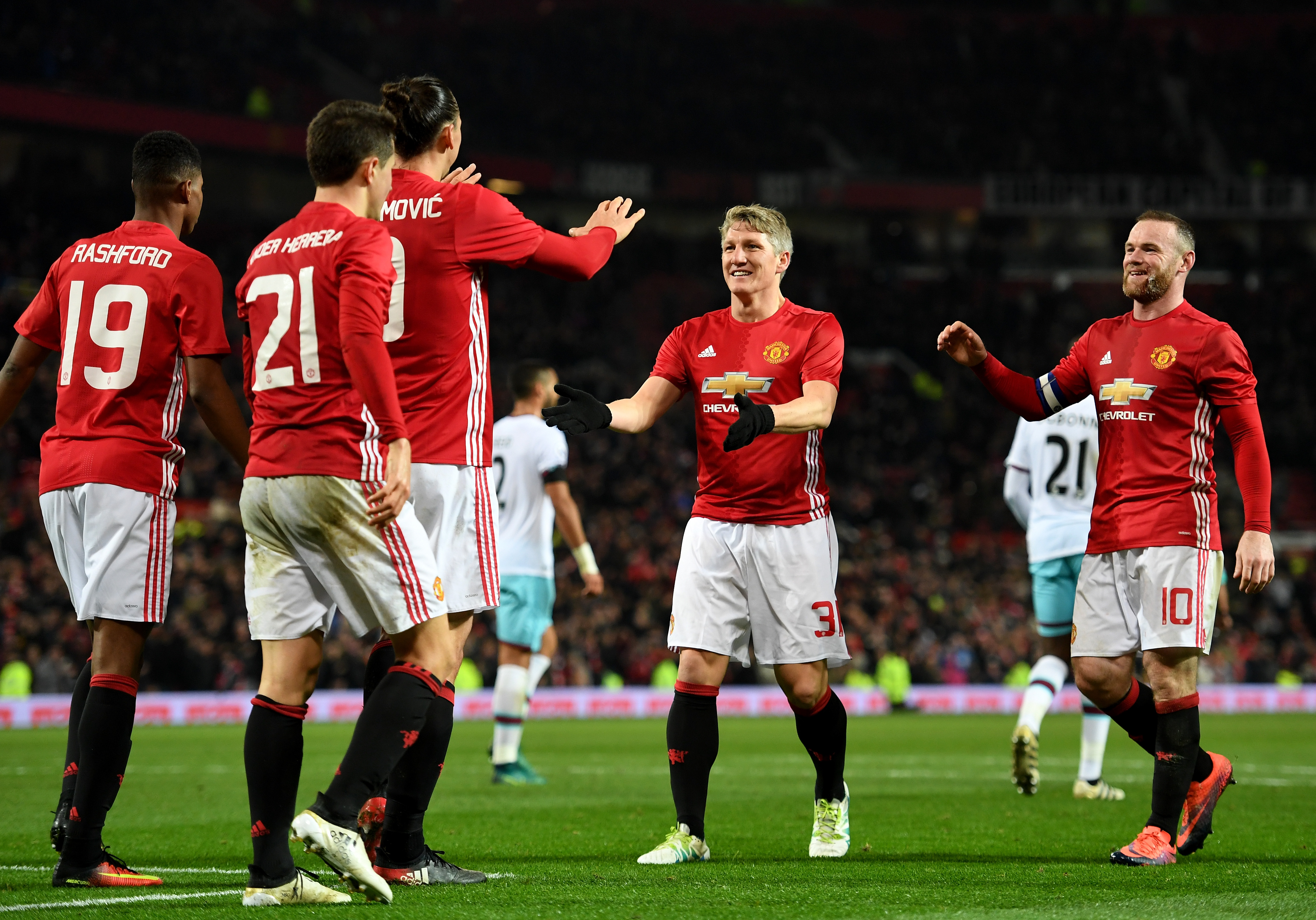 MANCHESTER, ENGLAND - NOVEMBER 30: Zlatan Ibrahimovic of Manchester United celebrates with team mates after scoring his team's fourth goal of the game during the EFL Cup quarter final match between Manchester United and West Ham United at Old Trafford on November 30, 2016 in Manchester, England. (Photo by Shaun Botterill/Getty Images)