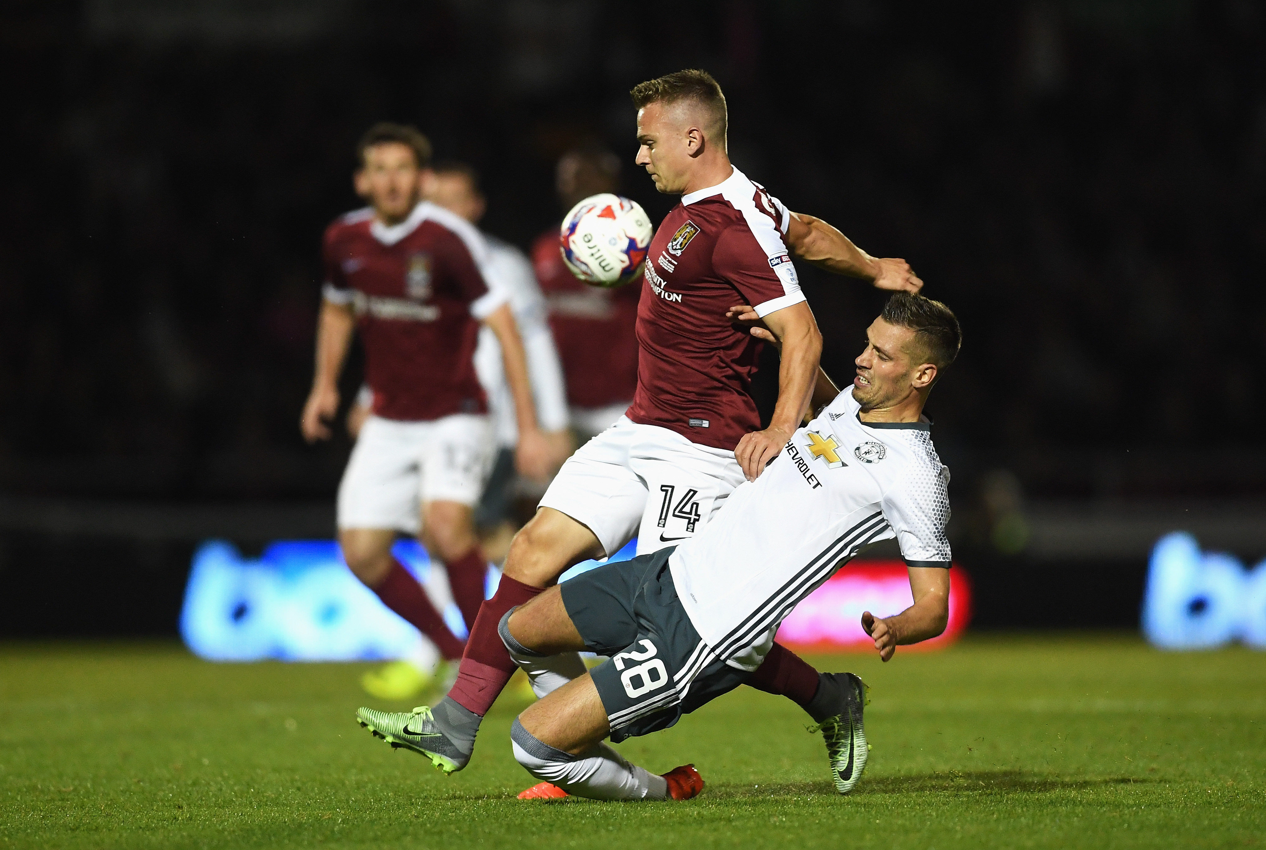 NORTHAMPTON, ENGLAND - SEPTEMBER 21: Sam Hoskins of Northampton Town is tackled by Morgan Schneiderlin of Manchester United during the EFL Cup Third Round match between Northampton Town and Manchester United at Sixfields on September 21, 2016 in Northampton, England. (Photo by Laurence Griffiths/Getty Images)