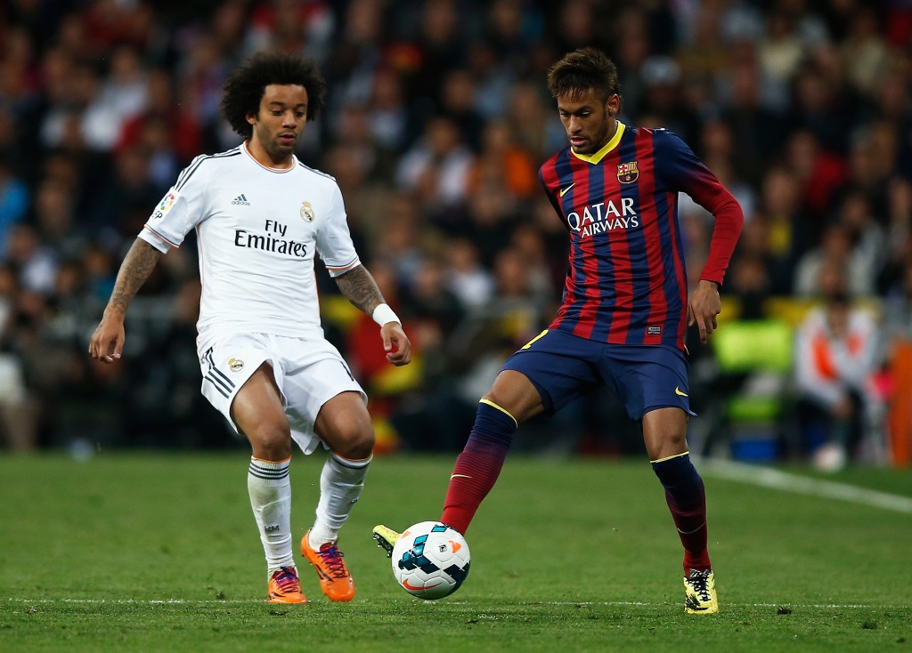 MADRID, SPAIN - MARCH 23: Neymar of Barcelona is closed down by Marcelo of Real Madrid during the La Liga match between Real Madrid CF and FC Barcelona at the Bernabeu on March 23, 2014 in Madrid, Spain. (Photo by Gonzalo Arroyo Moreno/Getty Images)