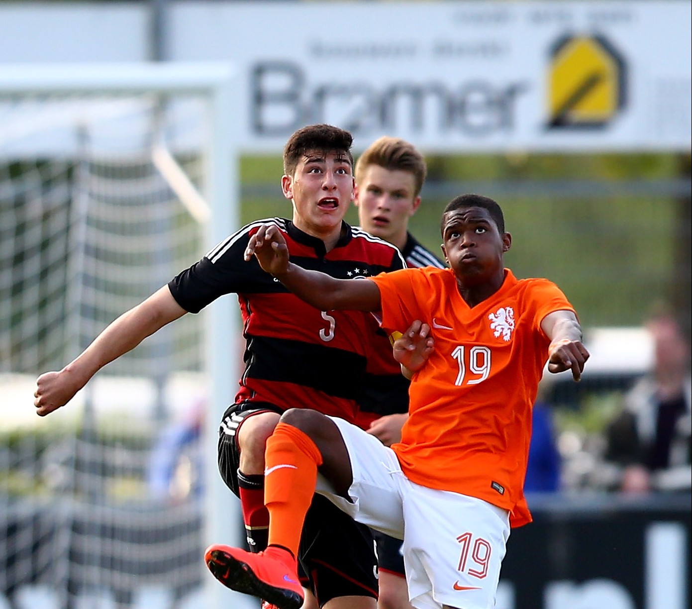 VRIEZENVEEN, NETHERLANDS - MAY 21: (L-R) Stefano Russo of Germany challenges Daishawn Redan of Netherlands during the international friendly match between U15 Netherlands and U15 Germany at the DETO Twenterand Stadium on May 21, 2015 in Vriezenveen, Netherlands. (Photo by Christof Koepsel/Bongarts/Getty Images)