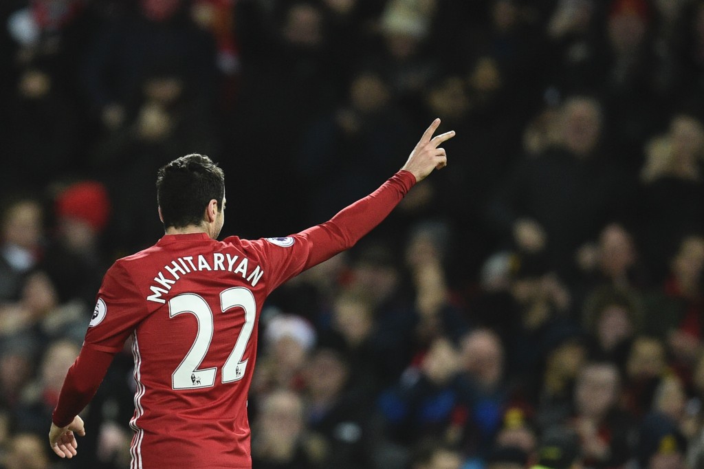 Manchester United's Armenian midfielder Henrikh Mkhitaryan celebrates scoring their third goal during the English Premier League football match between Manchester United and Sunderland at Old Trafford in Manchester, north west England, on December 26, 2016. / AFP / Oli SCARFF / RESTRICTED TO EDITORIAL USE. No use with unauthorized audio, video, data, fixture lists, club/league logos or 'live' services. Online in-match use limited to 75 images, no video emulation. No use in betting, games or single club/league/player publications. / (Photo credit should read OLI SCARFF/AFP/Getty Images)