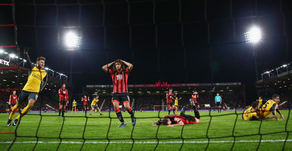 BOURNEMOUTH, ENGLAND - JANUARY 03: Nathan Ake (C-L) of AFC Bournemouth after Olivier Giroud (2nd R) of Arsenal scoring the third goal during the Premier League match between AFC Bournemouth and Arsenal at Vitality Stadium on January 3, 2017 in Bournemouth, England. (Photo by Michael Steele/Getty Images)