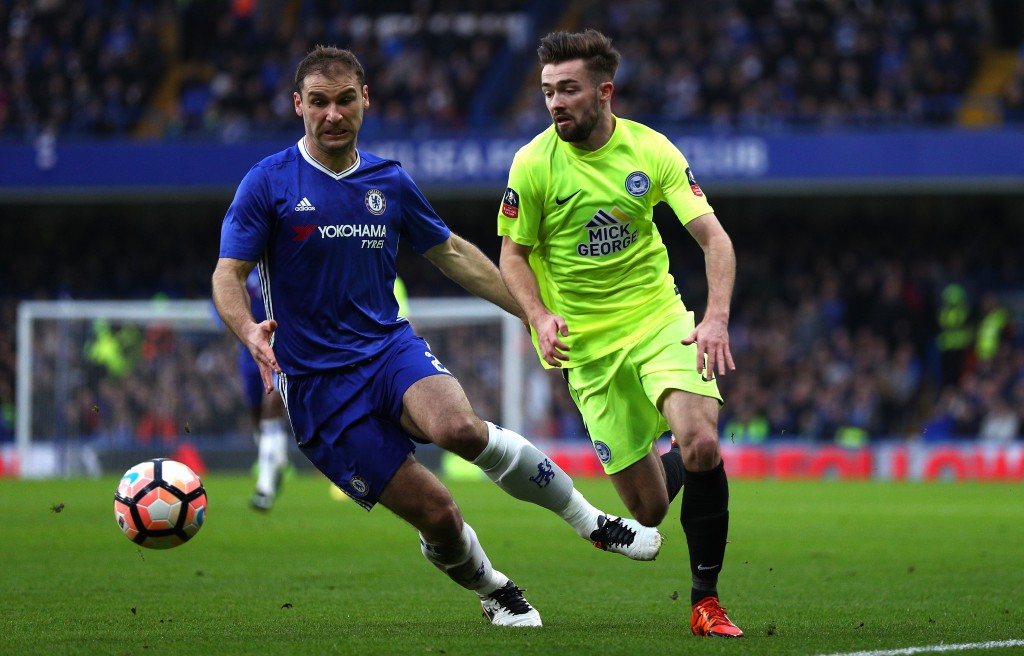 LONDON, ENGLAND - JANUARY 08: Branislav Ivanovic of Chelsea (L) is put under pressure from Gwion Edwards of Peterborough United (R) during The Emirates FA Cup Third Round match between Chelsea and Peterborough United at Stamford Bridge on January 8, 2017 in London, England. (Photo by Ian Walton/Getty Images)