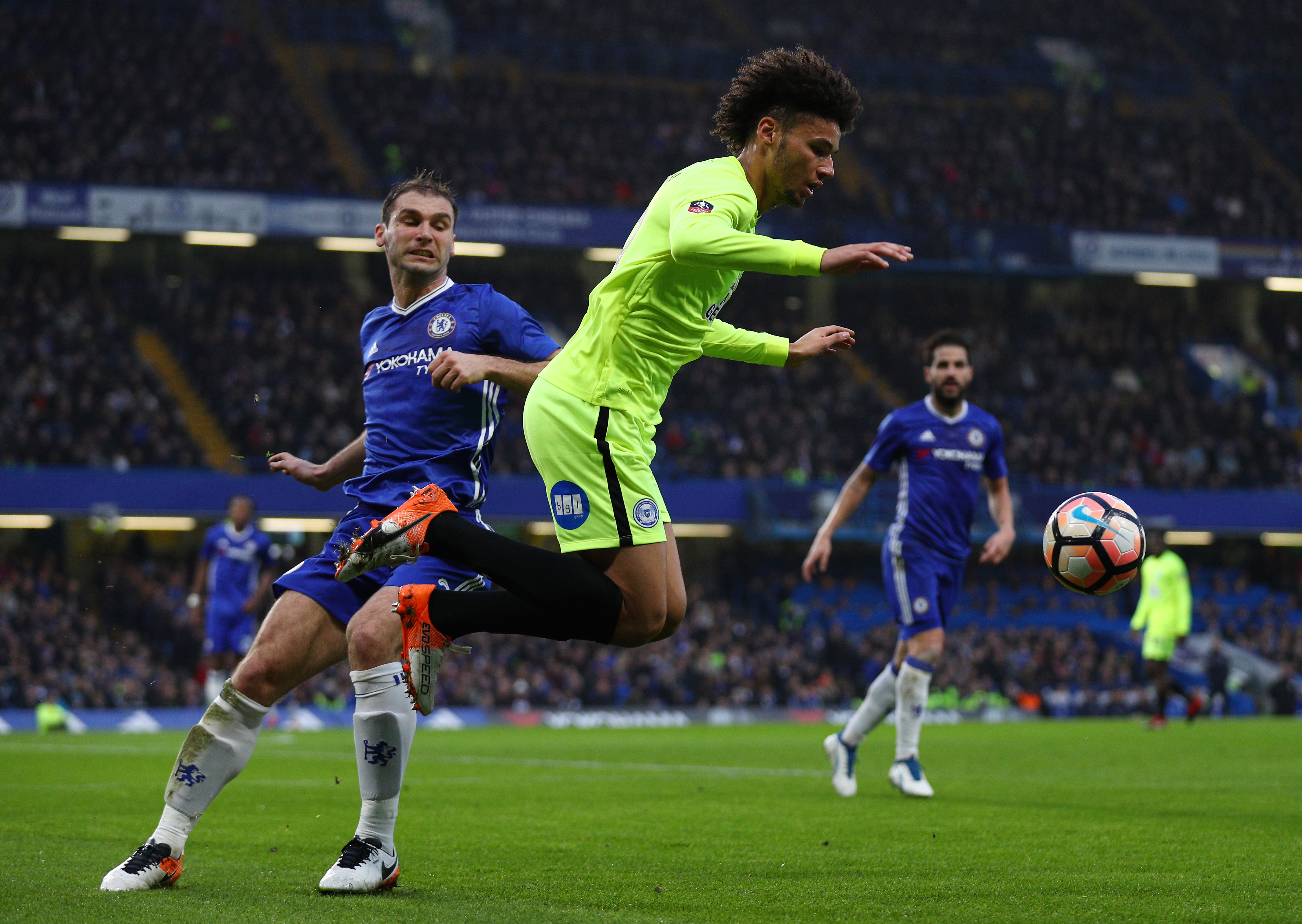 LONDON, ENGLAND - JANUARY 08: Branislav Ivanovic of Chelsea (L) fouls Lee Angol of Peterborough United (R) during The Emirates FA Cup Third Round match between Chelsea and Peterborough United at Stamford Bridge on January 8, 2017 in London, England. (Photo by Ian Walton/Getty Images)