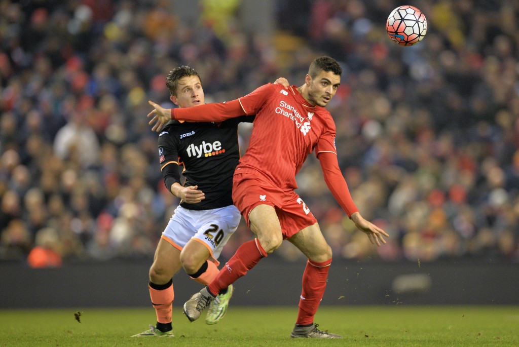 Exeter City's English striker Tom Nichols (L) vies with Liverpool's Portuguese defender Tiago Ilori during the English FA Cup third round replay football match between Liverpool and Exeter City at Anfield in Liverpool, north west England on January 20, 2016. (Photo by Paul Ellis/AFP/Getty Images) RESTRICTED TO EDITORIAL USE. No use with unauthorized audio, video, data, fixture lists, club/league logos or 'live' services. Online in-match use limited to 75 images, no video emulation. No use in betting, games or single club/league/player publications. / AFP / PAUL ELLIS (Photo credit should read PAUL ELLIS/AFP/Getty Images)