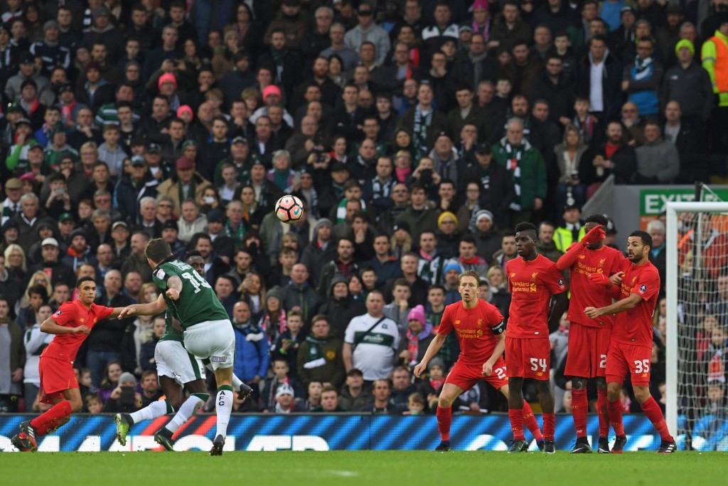 Plymouth's Irish midfielder Graham Carey (2nd L) takes a freekick during the English FA Cup third round football match between Liverpool and Plymouth Argyle at Anfield in Liverpool, north west England on January 8, 2017. (Photo by Paul Ellis/AFP/Getty Images)