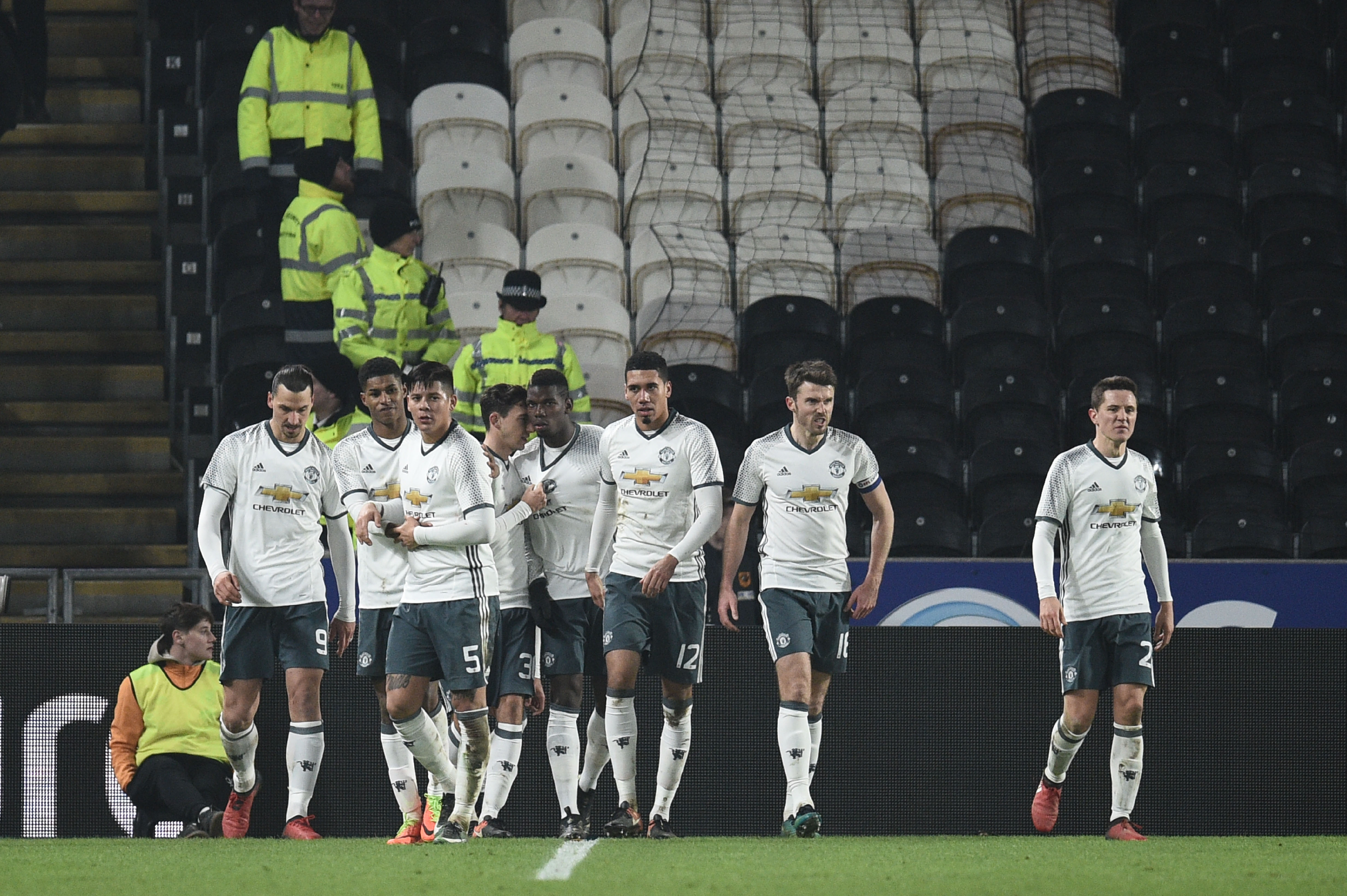 Manchester United's French midfielder Paul Pogba (C) celebrates with teammates afer scoring during the EFL (English Football League) Cup semi-final second-leg football match between Hull City and Manchester United at the KCOM Stadium in Kingston upon Hull, north east England on January 26, 2017.
/ AFP / Oli SCARFF / RESTRICTED TO EDITORIAL USE. No use with unauthorized audio, video, data, fixture lists, club/league logos or 'live' services. Online in-match use limited to 75 images, no video emulation. No use in betting, games or single club/league/player publications. / (Photo credit should read OLI SCARFF/AFP/Getty Images)