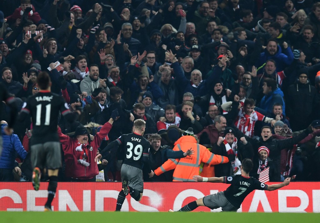 Southampton's Irish striker Shane Long (R) celebrates scoring his team's first goal during the EFL (English Football League) Cup semi-final second-leg football match between Liverpool and Southampton at Anfield in Liverpool, north west England on January 25, 2017. / AFP / Paul ELLIS / RESTRICTED TO EDITORIAL USE. No use with unauthorized audio, video, data, fixture lists, club/league logos or 'live' services. Online in-match use limited to 75 images, no video emulation. No use in betting, games or single club/league/player publications. / (Photo credit should read PAUL ELLIS/AFP/Getty Images)
