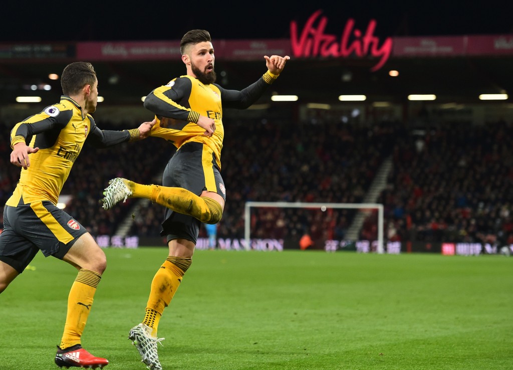 Arsenal's French striker Olivier Giroud celebrates after scoring their third goal during the English Premier League football match between Bournemouth and Arsenal at the Vitality Stadium in Bournemouth, southern England on January 3, 2017. / AFP / Glyn KIRK / RESTRICTED TO EDITORIAL USE. No use with unauthorized audio, video, data, fixture lists, club/league logos or 'live' services. Online in-match use limited to 75 images, no video emulation. No use in betting, games or single club/league/player publications. / (Photo credit should read GLYN KIRK/AFP/Getty Images)