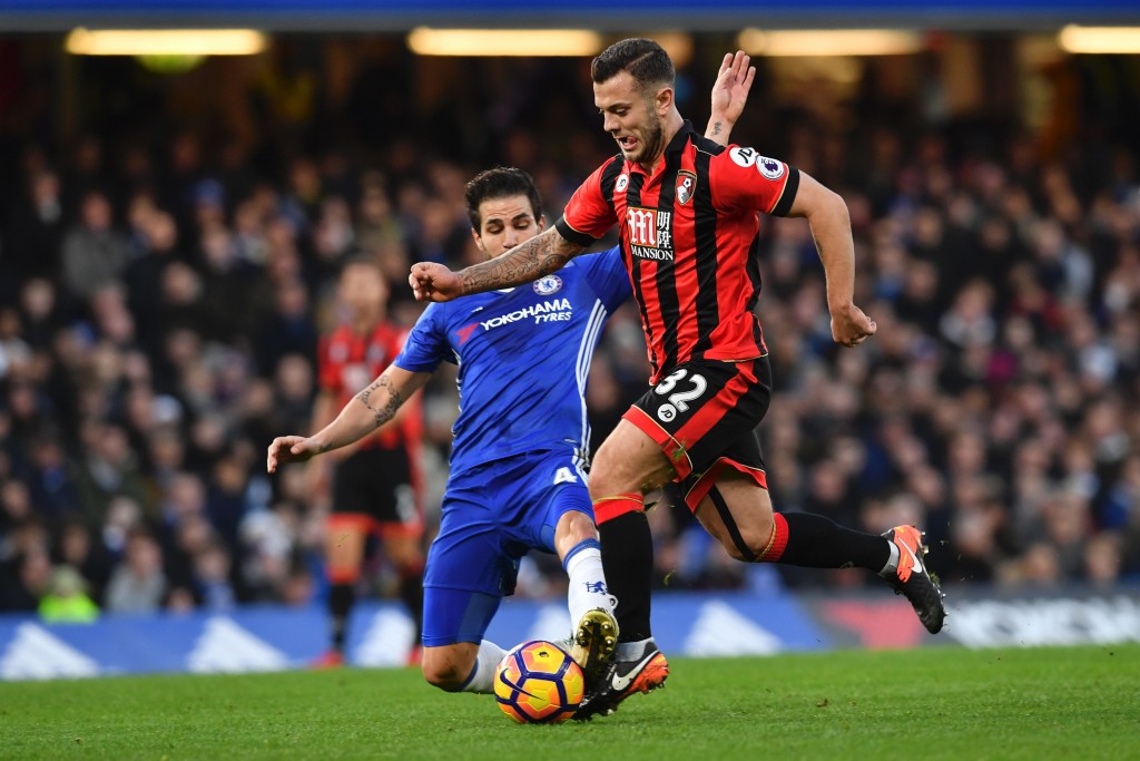 Chelsea's Spanish midfielder Cesc Fabregas (L) tackles Bournemouth's English midfielder Jack Wilshere (R) during the English Premier League football match between Chelsea and Bournemouth at Stamford Bridge in London on December 26, 2016. / AFP / Ben STANSALL / RESTRICTED TO EDITORIAL USE. No use with unauthorized audio, video, data, fixture lists, club/league logos or 'live' services. Online in-match use limited to 75 images, no video emulation. No use in betting, games or single club/league/player publications. / (Photo credit should read BEN STANSALL/AFP/Getty Images)