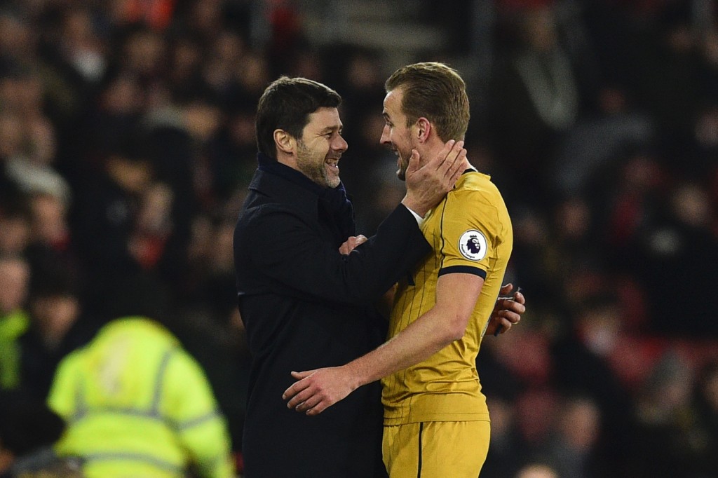 Tottenham Hotspur's Argentinian head coach Mauricio Pochettino (L) embraces Tottenham Hotspur's English striker Harry Kane (R) as he leaves the field substituted during the English Premier League football match between Southampton and Tottenham Hotspur at St Mary's Stadium in Southampton, southern England on December 28, 2016. (Photo by Glyn Kirk/AFP/Getty Images)