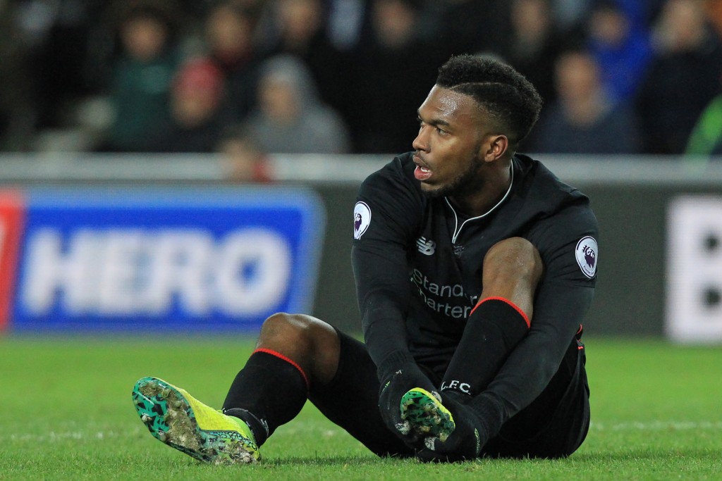 Liverpool's English striker Daniel Sturridge holds his foot after appearing to pick up an injury during the English Premier League football match between Sunderland and Liverpool at the Stadium of Light in Sunderland, north-east England on January 2, 2017. The game finished 2-2. / AFP / Lindsey PARNABY / RESTRICTED TO EDITORIAL USE. No use with unauthorized audio, video, data, fixture lists, club/league logos or 'live' services. Online in-match use limited to 75 images, no video emulation. No use in betting, games or single club/league/player publications. / (Photo credit should read LINDSEY PARNABY/AFP/Getty Images)
