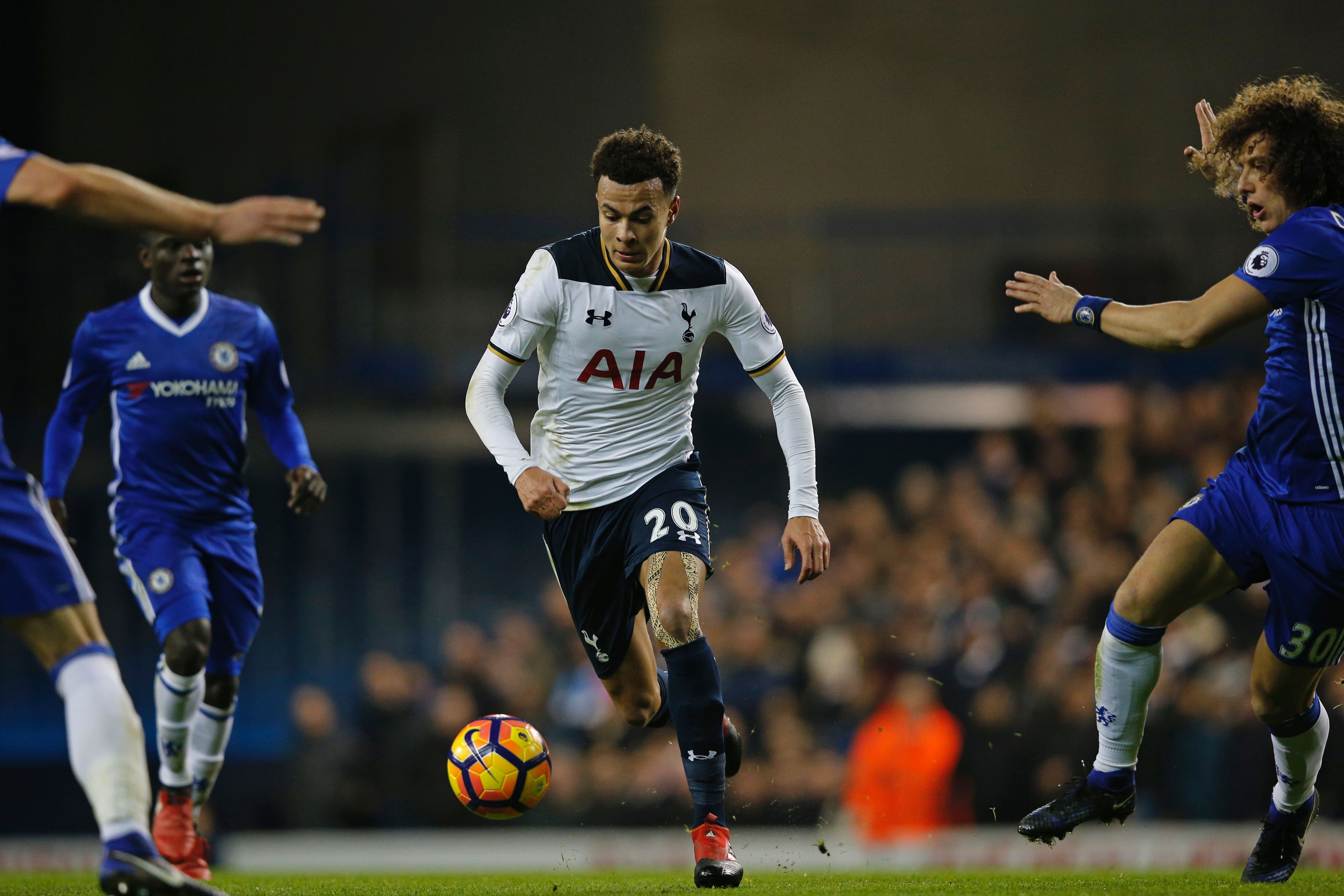 Tottenham Hotspur's English midfielder Dele Alli runs with the ball during the English Premier League football match between Tottenham Hotspur and Chelsea at White Hart Lane in London, on January 4, 2017. / AFP / Adrian DENNIS / RESTRICTED TO EDITORIAL USE. No use with unauthorized audio, video, data, fixture lists, club/league logos or 'live' services. Online in-match use limited to 75 images, no video emulation. No use in betting, games or single club/league/player publications. / (Photo credit should read ADRIAN DENNIS/AFP/Getty Images)