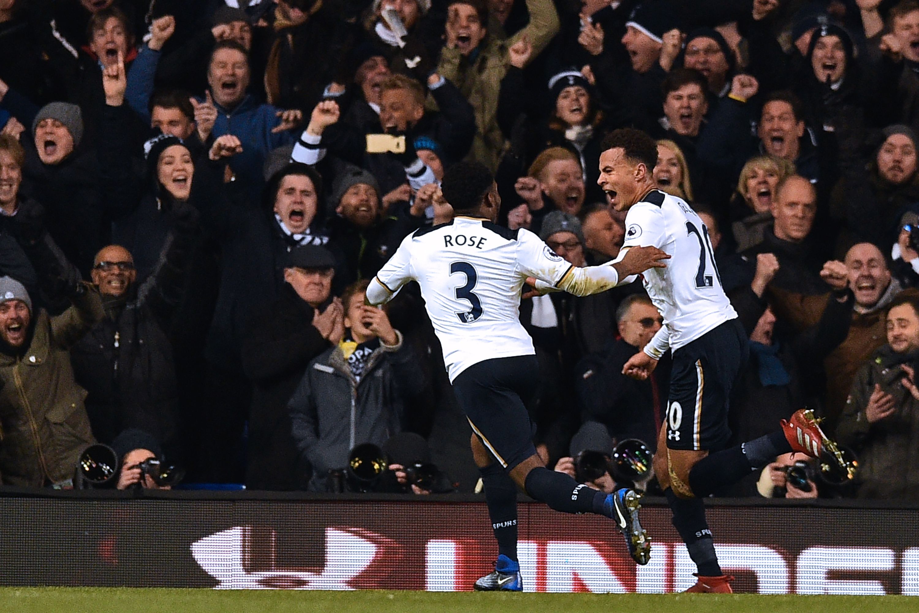Tottenham Hotspur's English midfielder Dele Alli celebrates with Tottenham Hotspur's English defender Danny Rose (L) after scoring the opening goal of the English Premier League football match between Tottenham Hotspur and Chelsea at White Hart Lane in London, on January 4, 2017. (Photo credit should read IKIMAGES/AFP/Getty Images)