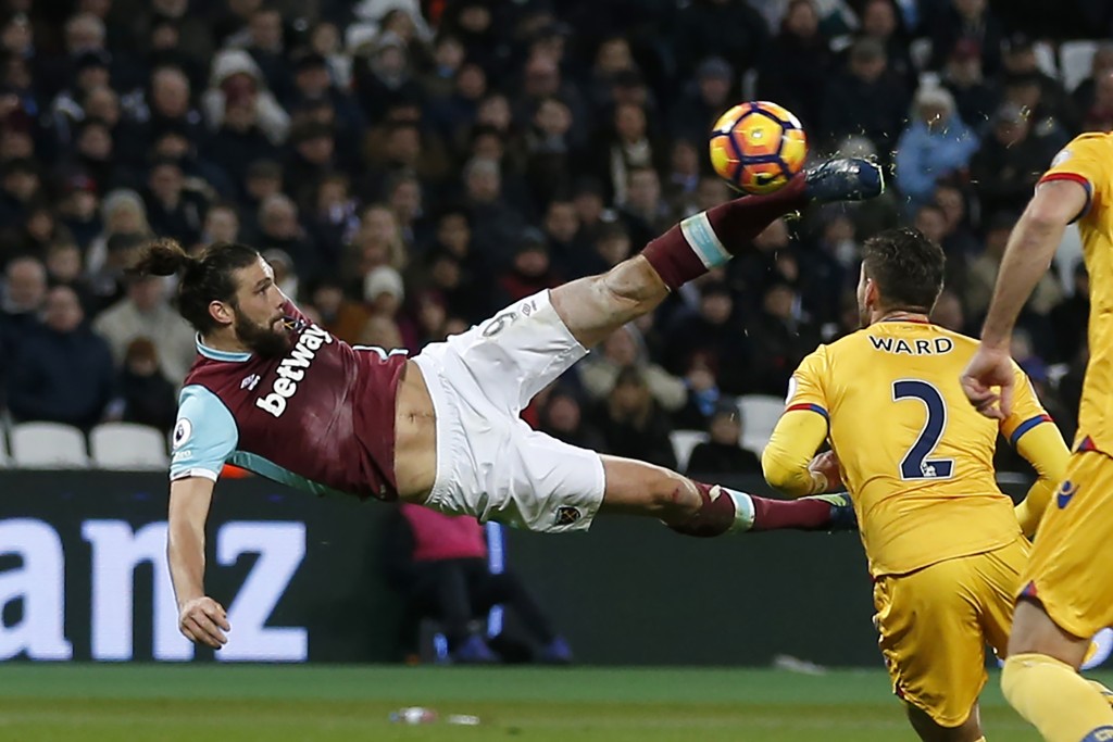 West Ham United's English striker Andy Carroll shoots to score their second goal with this bicycle kick during the English Premier League football match between West Ham United and Crystal Palace at The London Stadium, in east London on January 14, 2017. (Photo by Ian Kington/AFP/Getty Images)
