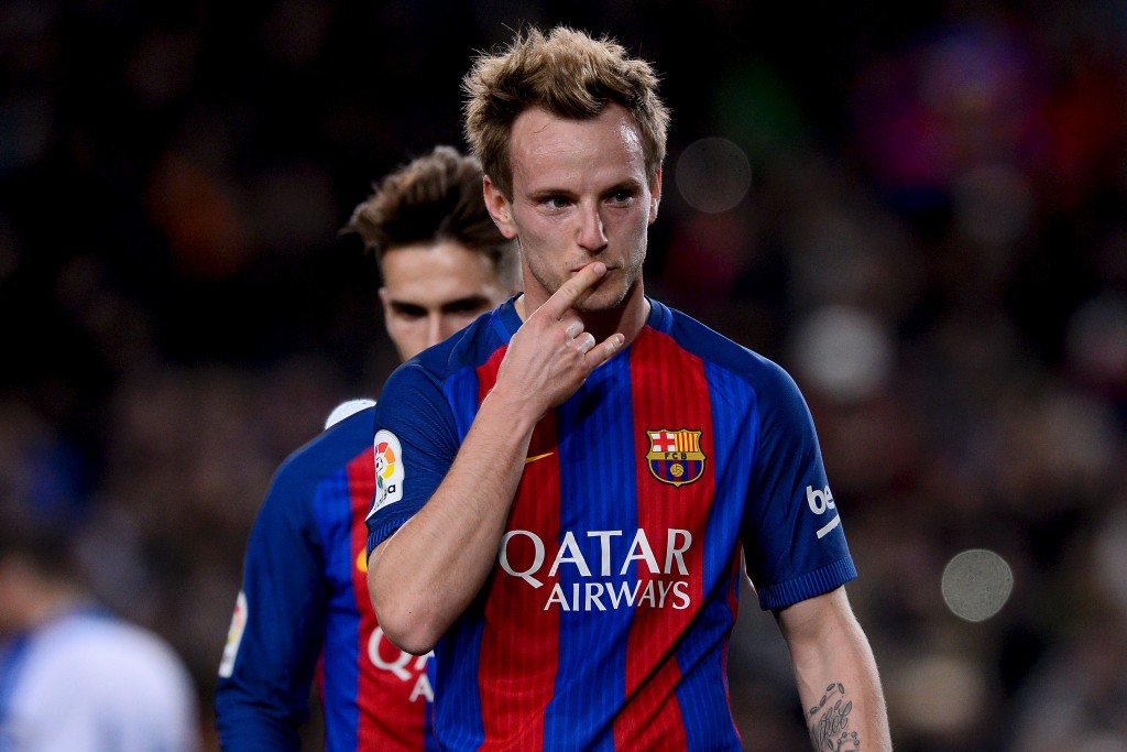 Barcelona's Croatian midfielder Ivan Rakitic celebrates after scoring during the Spanish Copa del Rey (King's Cup) round of 32 second leg football match FC Barcelona vs Hercules CF at the Camp Nou stadium in Barcelona on December 21, 2016. / AFP / JOSEP LAGO (Photo credit should read JOSEP LAGO/AFP/Getty Images)