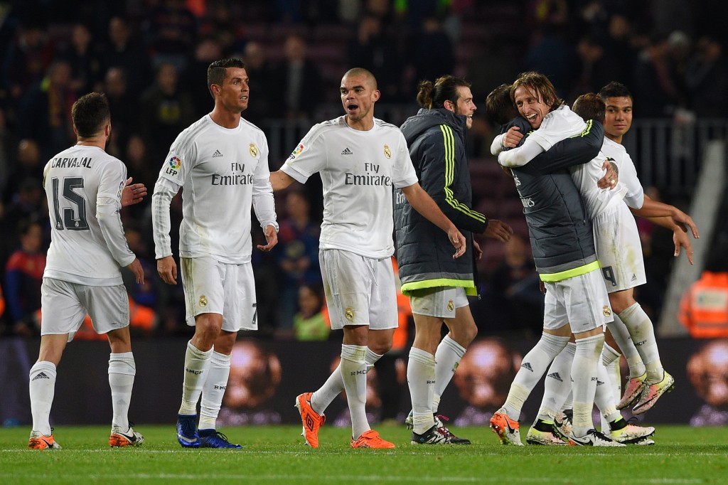 Madrid's players celebrate after winning the Spanish league "Clasico" football match FC Barcelona vs Real Madrid CF at the Camp Nou stadium in Barcelona on April 2, 2016. / AFP / LLUIS GENE (Photo credit should read LLUIS GENE/AFP/Getty Images)