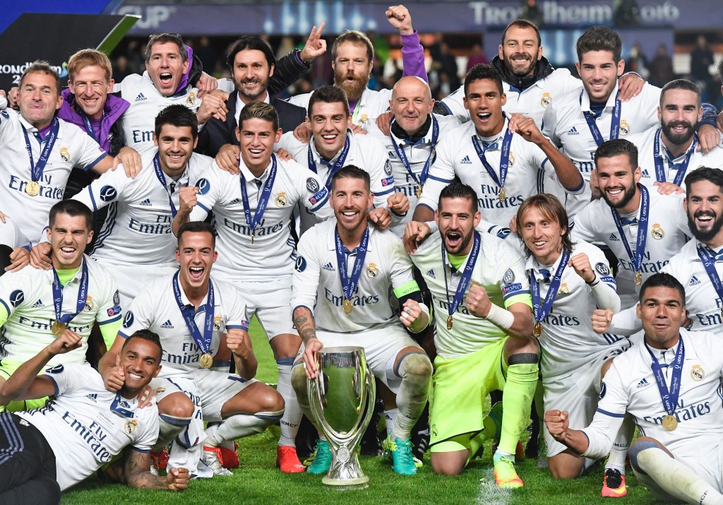 Real Madrid's players celebrate with the trophy after winning the UEFA Super Cup final football match between Real Madrid CF and Sevilla FC on August 9, 2016 at the Lerkendal Stadion in Trondheim. / AFP / JONATHAN NACKSTRAND (Photo credit should read JONATHAN NACKSTRAND/AFP/Getty Images)