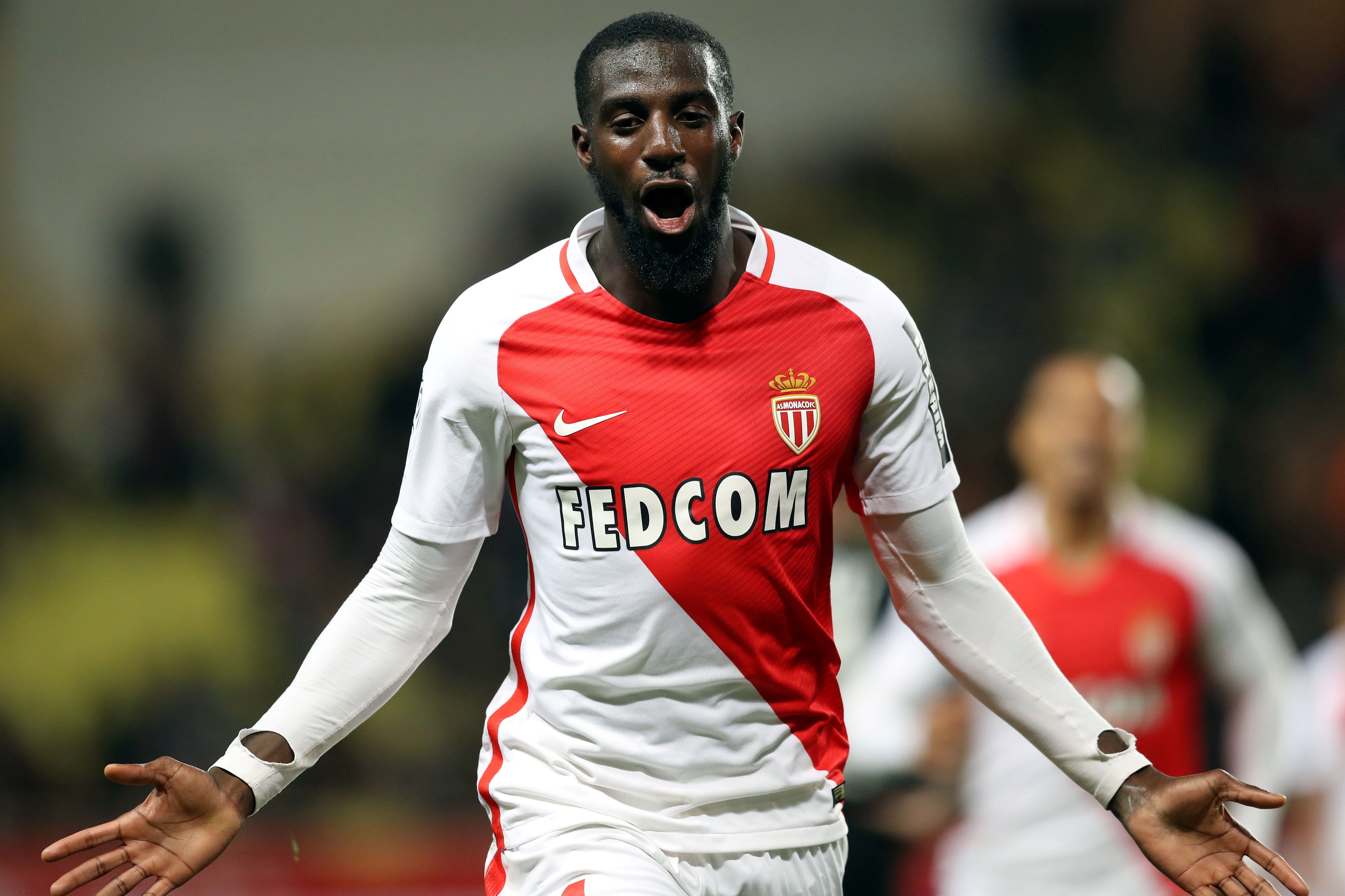 Monaco's French midfielder Tiemoue Bakayoko celebrates after scoring a goal during the French L1 football match between Monaco (ASM) and Caen (SMC) on December 21, 2016 at the Louis II Stadium in Monaco. / AFP / VALERY HACHE (Photo credit should read VALERY HACHE/AFP/Getty Images)