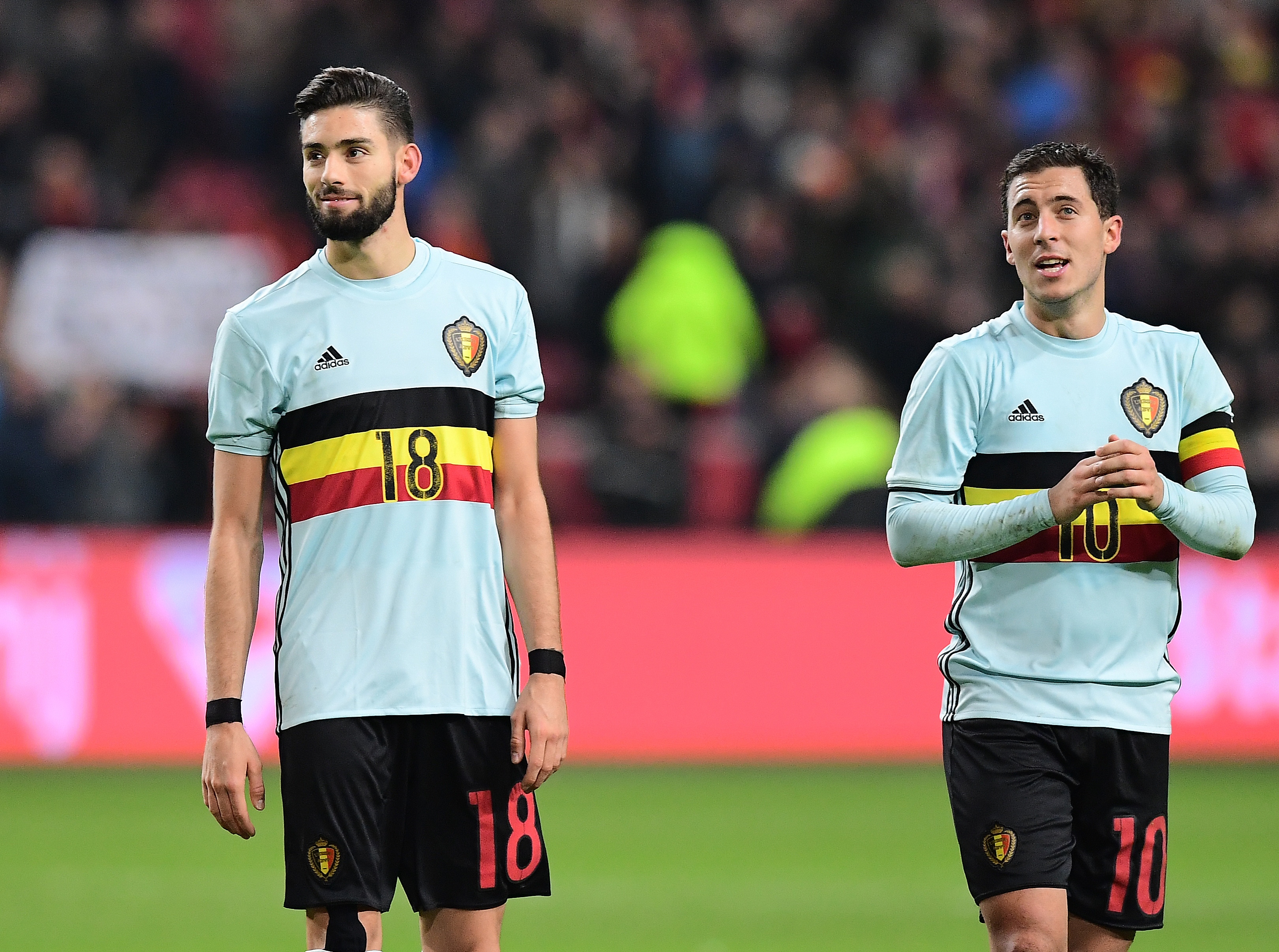 Belgium's forward Eden Hazard (R) and Belgium's midfielder Yannick Ferreira-Carrasco greet their supporters at the end of the friendly football match between The Netherlands and Belgium at the Amsterdam Arena in Amsterdam on November 9, 2016. / AFP / EMMANUEL DUNAND (Photo credit should read EMMANUEL DUNAND/AFP/Getty Images)