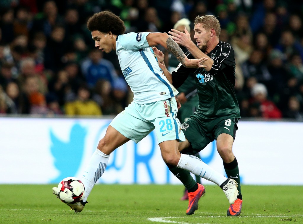 KRASNODAR, RUSSIA - NOVEMBER 27: Yuri Gazinski (R) of FC Krasnodar is challenged by Axel Witsel of FC Zenit St. Petersburg during the Russian Premier League match between FC Krasnodar v FC Zenit St. Petersburg at Krasnodar Stadium on November 27, 2016 in Krasnodar, Russia. (Photo by Epsilon/Getty Images)
