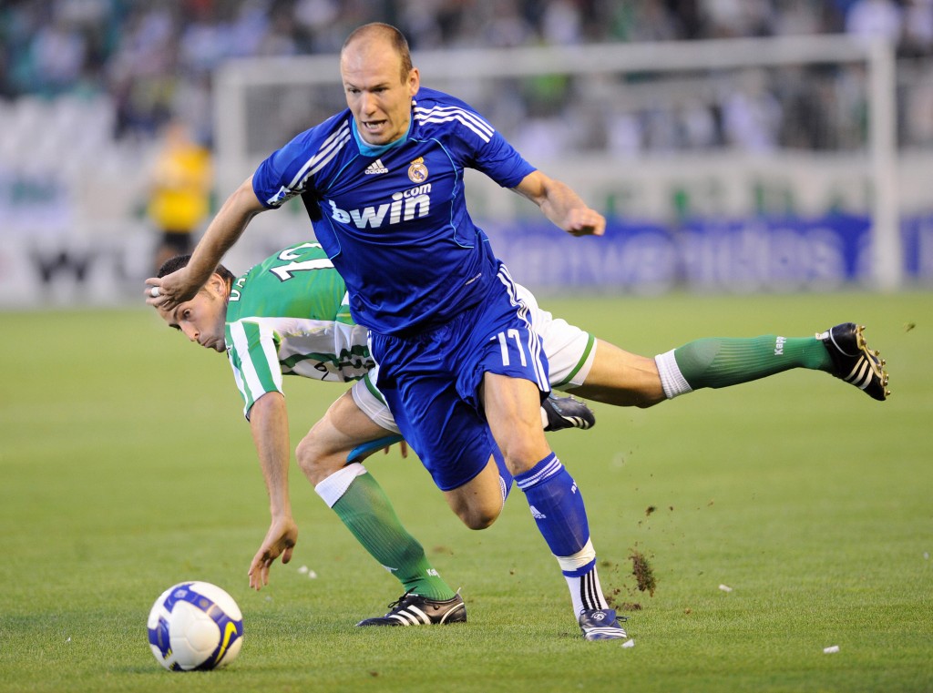(FILES) -- A file photo taken on September 27, 2008 shows Real Madrid's Dutch winger Arjen Robben (R) fighting for the ball with Betis' Damia Abella during their Spanish league football match at the Ruiz de Lopera's stadium in Sevilla. Robben is doubtful for the derby against Atletico Madrid due to a thigh injury, Spanish sports daily As reported on October 7, 2008. Ex-Chelsea star Robben had been earlier ruled out of Holland's World Cup qualifiers against Iceland on Saturday and Norway on October 15. AFP PHOTO/ CRISTINA QUICLER (Photo credit should read CRISTINA QUICLER/AFP/Getty Images)