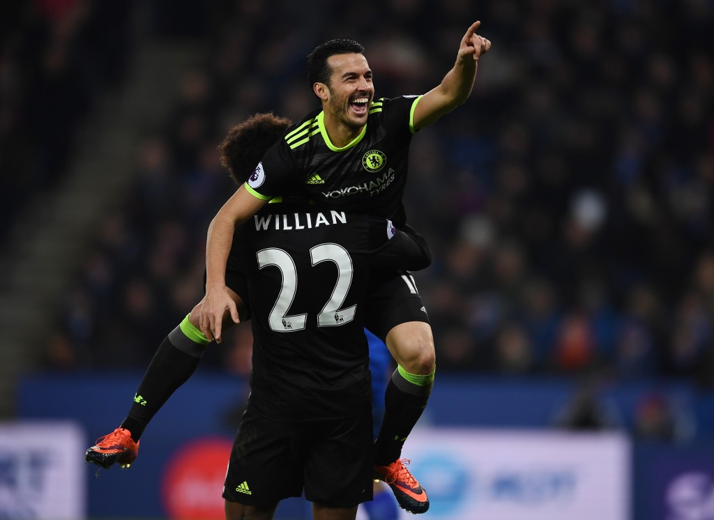 LEICESTER, ENGLAND - JANUARY 14: Pedro of Chelsea celebrates with teammate Willian of Chelsea after scoring their team's third goal during the Premier League match between Leicester City and Chelsea at The King Power Stadium on January 14, 2017 in Leicester, England. (Photo by Laurence Griffiths/Getty Images)
