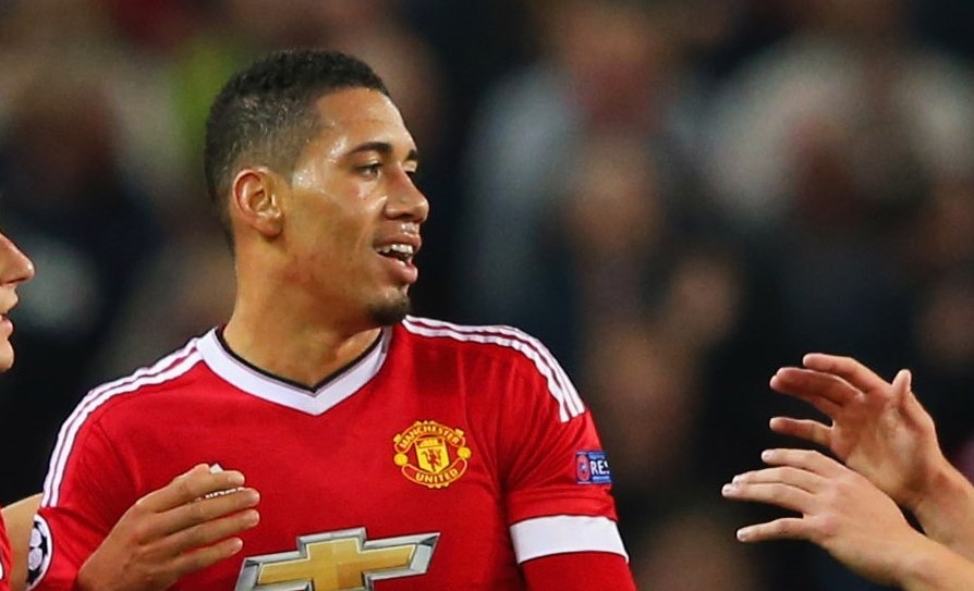 MANCHESTER, ENGLAND - SEPTEMBER 30: (L-R) Matteo Darmian, Chris Smalling, Phil Jones and Daley Blind of Manchester United celebrate victory after the UEFA Champions League Group B match between Manchester United FC and VfL Wolfsburg at Old Trafford on September 30, 2015 in Manchester, United Kingdom. (Photo by Alex Livesey/Bongarts/Getty Images)