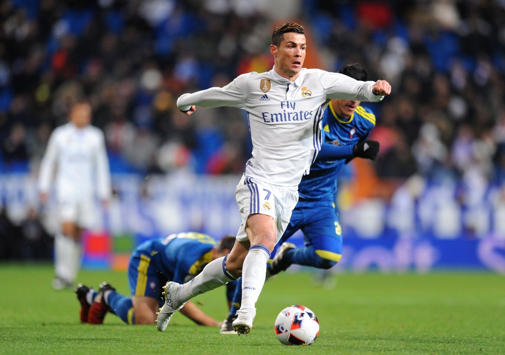 MADRID, SPAIN - JANUARY 18: Cristiano Ronaldo of Real Madrid in action against Facundo Roncaglia of Celta de Vigo during the Copa del Rey Quarter Final, First Leg match between Real Madrid CF and Celta Vigo at Bernabeu on January 18, 2017 in Madrid, Spain. (Photo by Denis Doyle/Getty Images)