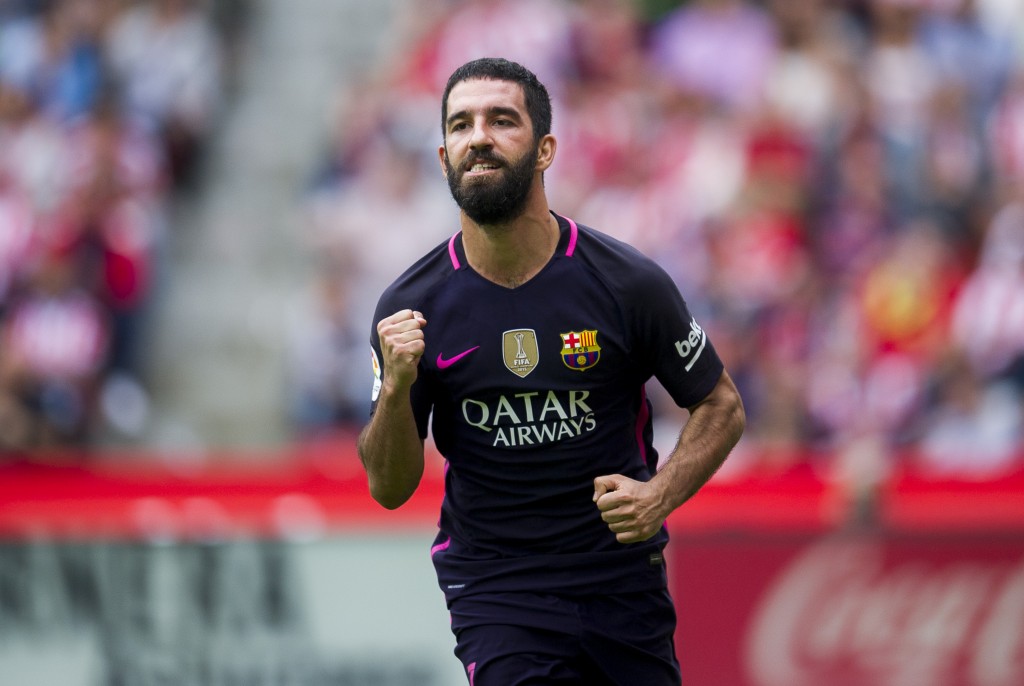 GIJON, SPAIN - SEPTEMBER 24: Arda Turan of FC Barcelona celebrates after scoring his team's fourth goal during the La Liga match between Real Sporting de Gijon and FC Barcelona at Estadio El Molinon on September 24, 2016 in Gijon, Spain. (Photo by Juan Manuel Serrano Arce/Getty Images)