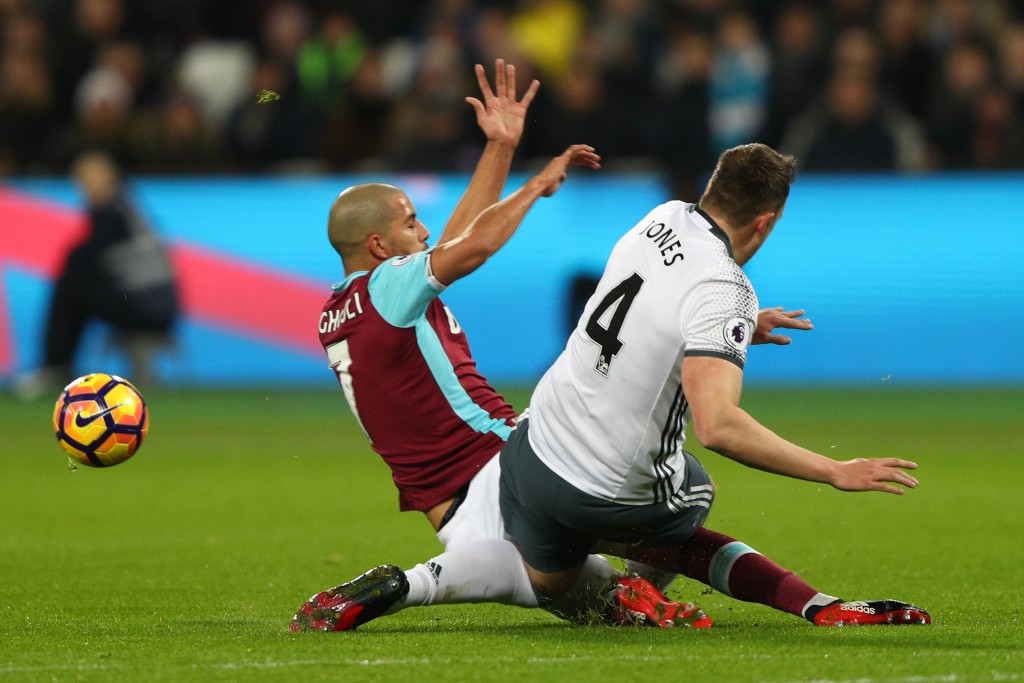 STRATFORD, ENGLAND - JANUARY 02: Sofiane Feghouli of West Ham United challenges Phil Jones of Manchester United leading to his sending off during the Premier League match between West Ham United and Manchester United at London Stadium on January 2, 2017 in Stratford, England. (Photo by Ian Walton/Getty Images)