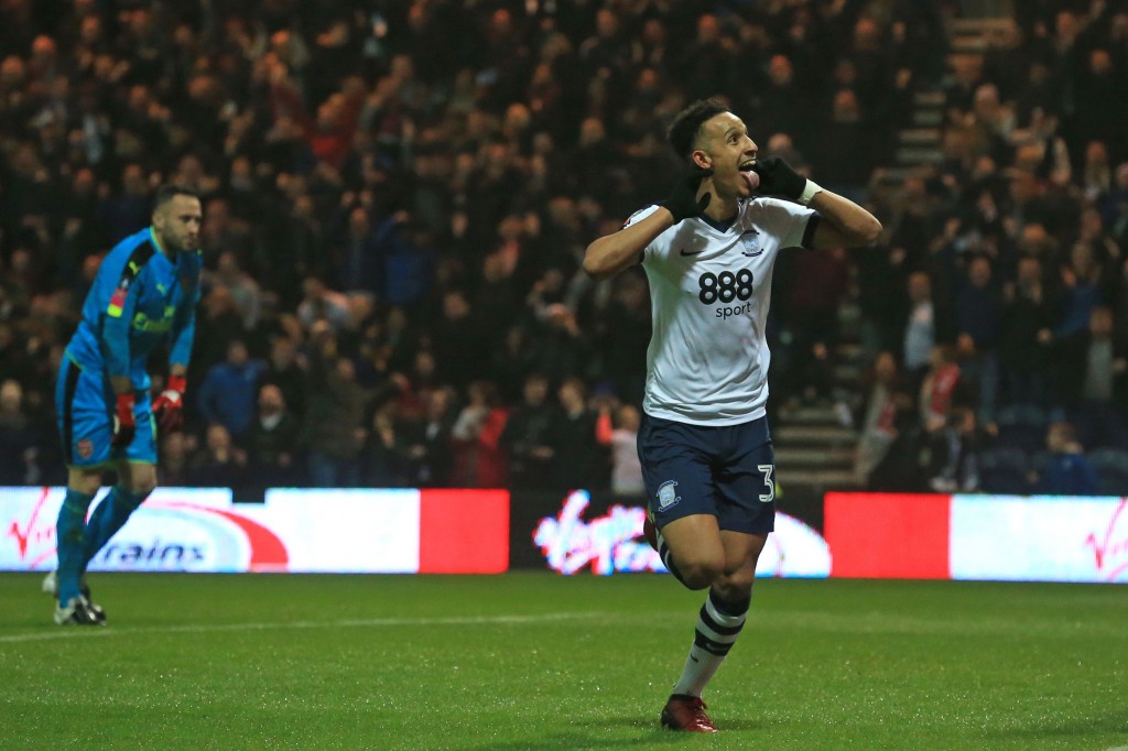 Preston's English striker Callum Robinson celebrates after scoring the opening goal as Arsenal's Colombian goalkeeper David Ospina (L) reacts during the English FA Cup third round football match between Preston North End and Arsenal at Deepdale in north west England on January 7, 2017. / AFP / Lindsey PARNABY / RESTRICTED TO EDITORIAL USE. No use with unauthorized audio, video, data, fixture lists, club/league logos or 'live' services. Online in-match use limited to 75 images, no video emulation. No use in betting, games or single club/league/player publications.  /         (Photo credit should read LINDSEY PARNABY/AFP/Getty Images)