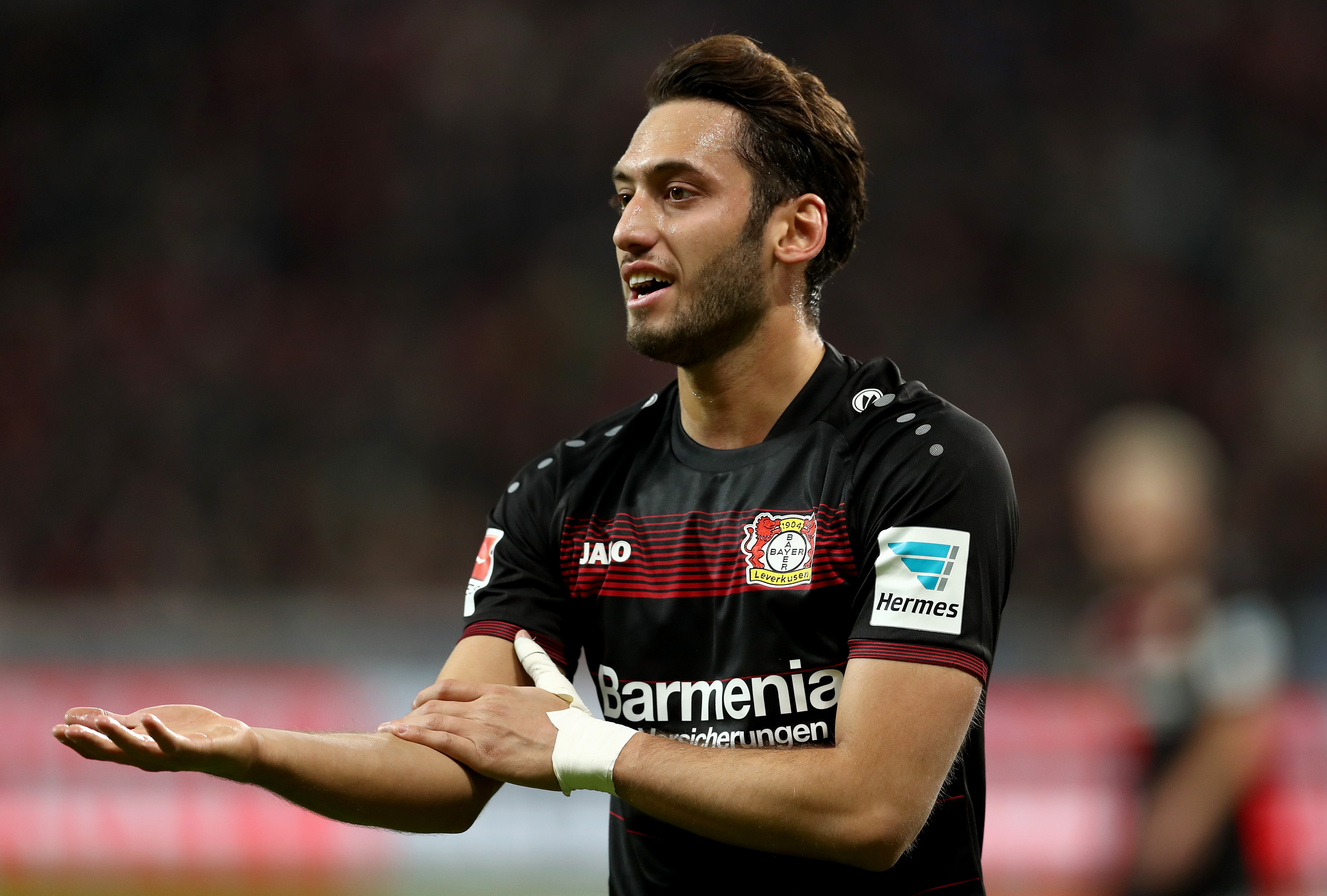 LEVERKUSEN, GERMANY - JANUARY 28: Hakan Calhanoglu of Bayer Leverkusen gestures during the Bundesliga match between Bayer 04 Leverkusen and Borussia Moenchengladbach at BayArena on January 28, 2017 in Leverkusen, Germany. (Photo by Lars Baron/Bongarts/Getty Images)