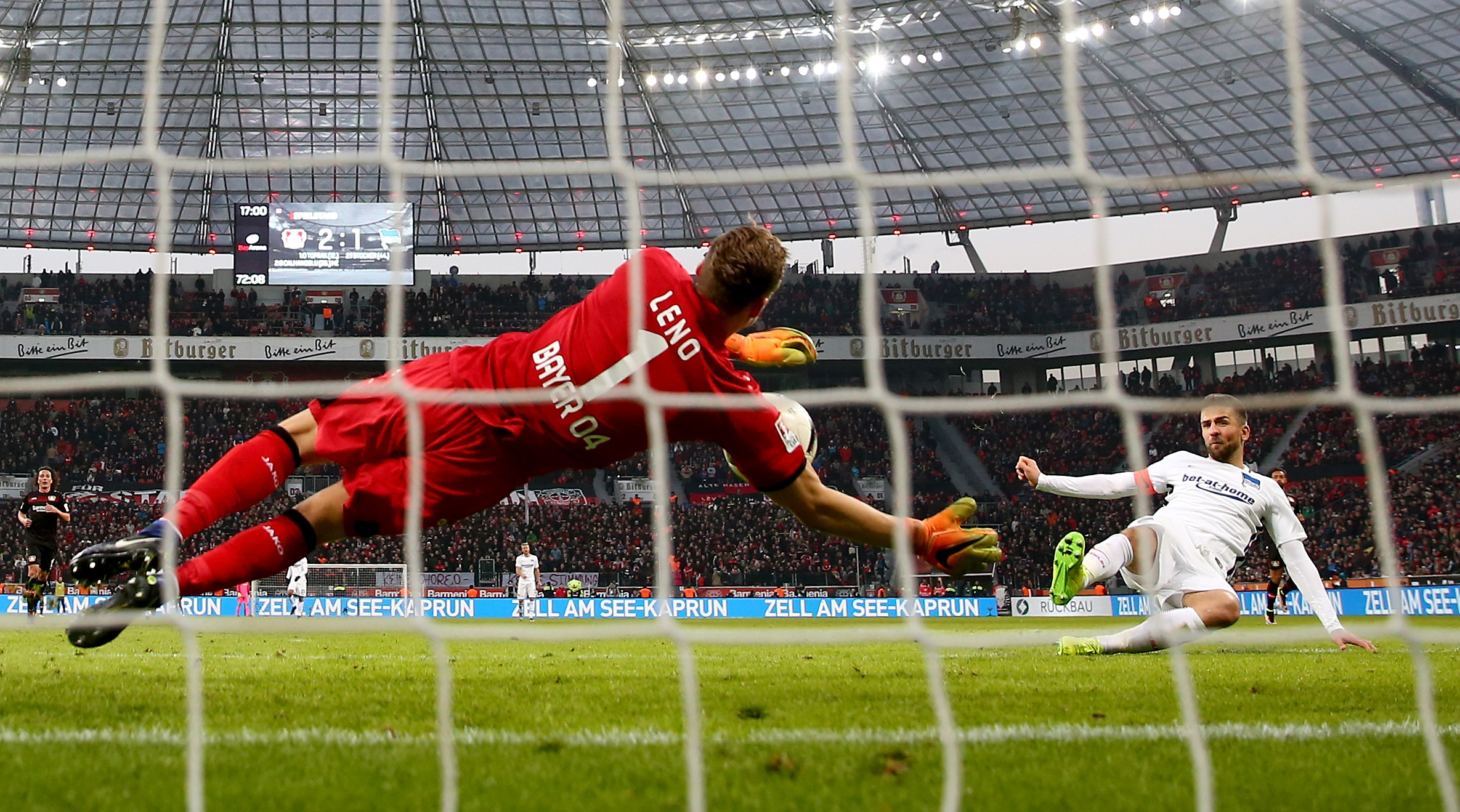 LEVERKUSEN, GERMANY - JANUARY 22: Bernd Leno of Bayer Leverkusen saves a shot of Vedad Ibisevic of Berlin during the Bundesliga match between Bayer 04 Leverkusen and Hertha BSC at BayArena on January 22, 2017 in Leverkusen, Germany. (Photo by Lars Baron/Bongarts/Getty Images)