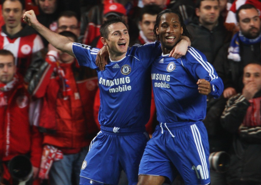 LONDON - MARCH 05: Frank Lampard of Chelsea (L) celebrates with team mate Didier Drogba as he scores their second goal during the UEFA Champions League first knockout round, second leg match between Chelsea and Olympiakos at Stamford Bridge on March 5, 2008 in London, England. (Photo by Phil Cole/Getty Images)