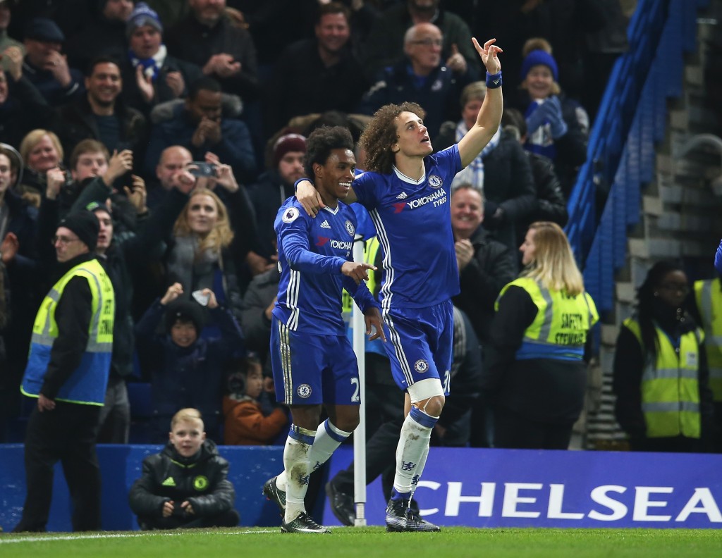 LONDON, ENGLAND - DECEMBER 31: Willian (L) of Chelsea celebrates scoring his team's second goal with his team mate David Luiz (R) during the Premier League match between Chelsea and Stoke City at Stamford Bridge on December 31, 2016 in London, England. (Photo by Steve Bardens/Getty Images)