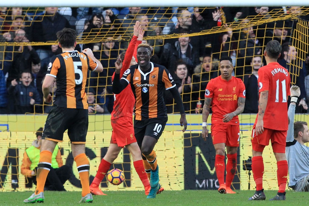Hull City's French midfielder Alfred N'Diaye (C) celebrates after scoring the opening goal of the English Premier League football match between Hull City and Liverpool at the KCOM Stadium in Kingston upon Hull, north east England on February 4, 2017. / AFP / Lindsey PARNABY / RESTRICTED TO EDITORIAL USE. No use with unauthorized audio, video, data, fixture lists, club/league logos or 'live' services. Online in-match use limited to 75 images, no video emulation. No use in betting, games or single club/league/player publications. / (Photo credit should read LINDSEY PARNABY/AFP/Getty Images)
