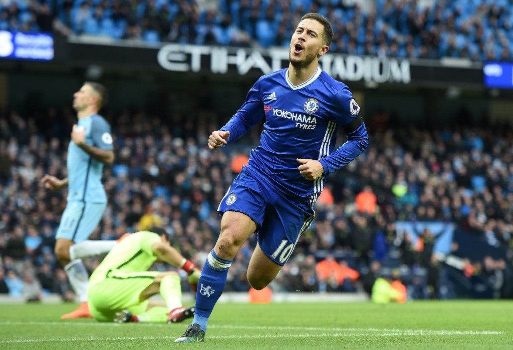 Chelsea's Belgian midfielder Eden Hazard celebrates scoring his team's third goal during the English Premier League football match between Manchester City and Chelsea at the Etihad Stadium in Manchester, north west England, on December 3, 2016. / AFP / Paul ELLIS / RESTRICTED TO EDITORIAL USE. No use with unauthorized audio, video, data, fixture lists, club/league logos or 'live' services. Online in-match use limited to 75 images, no video emulation. No use in betting, games or single club/league/player publications. / (Photo credit should read PAUL ELLIS/AFP/Getty Images)