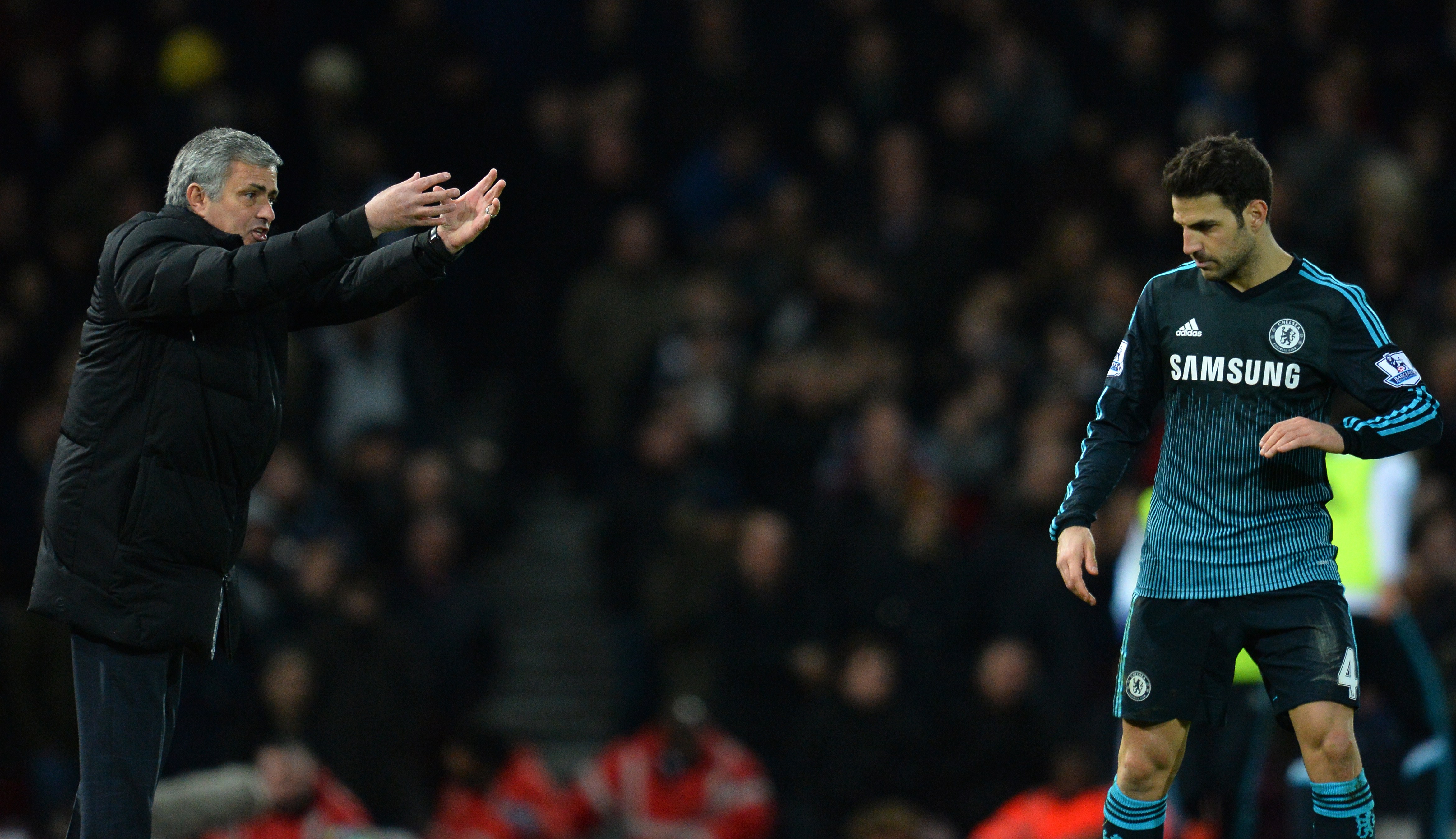 Chelsea's Portuguese manager Jose Mourinho gestures to Chelsea's Spanish midfielder Cesc Fabregas (R) during the English Premier League football match between West Ham United and Chelsea at the Boleyn Ground in Upton Park, East London on March 4, 2015. Chelsea won the game 1-0. AFP PHOTO / GLYN KIRK

RESTRICTED TO EDITORIAL USE. NO USE WITH UNAUTHORIZED AUDIO, VIDEO, DATA, FIXTURE LISTS, CLUB/LEAGUE LOGOS OR "LIVE" SERVICES. ONLINE IN-MATCH USE LIMITED TO 45 IMAGES, NO VIDEO EMULATION. NO USE IN BETTING, GAMES OR SINGLE CLUB/LEAGUE/PLAYER PUBLICATIONS.        (Photo credit should read GLYN KIRK/AFP/Getty Images)